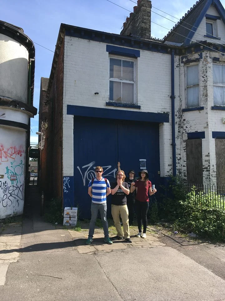 Adam's photo of Paul, Mary, Chris and Tom from DCW outside a haunted house in Hull that's mentioned in a Black Kes song.