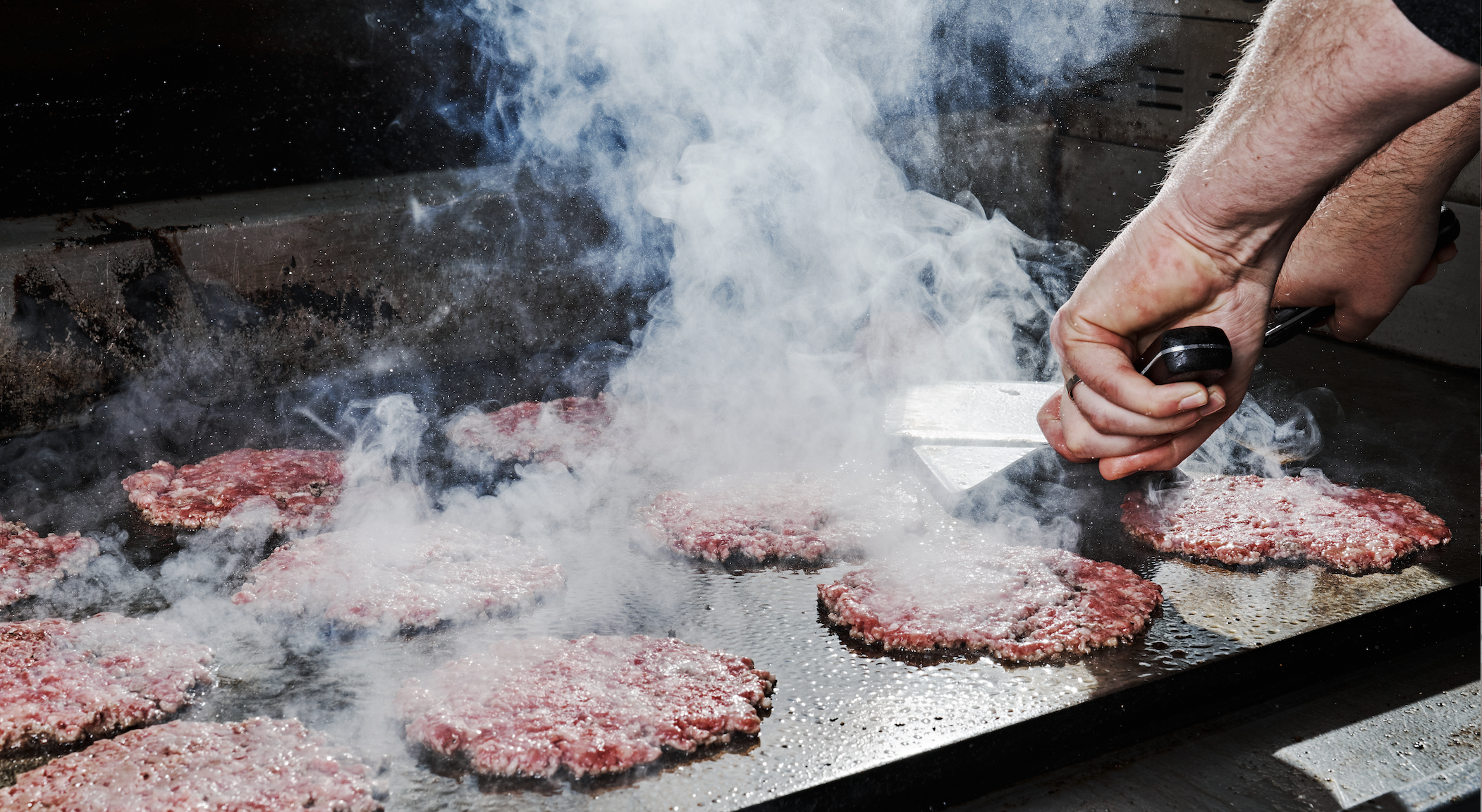 Hugh-Baby's BBQ & Burger Shop SmashBurgers on Flat Top.png