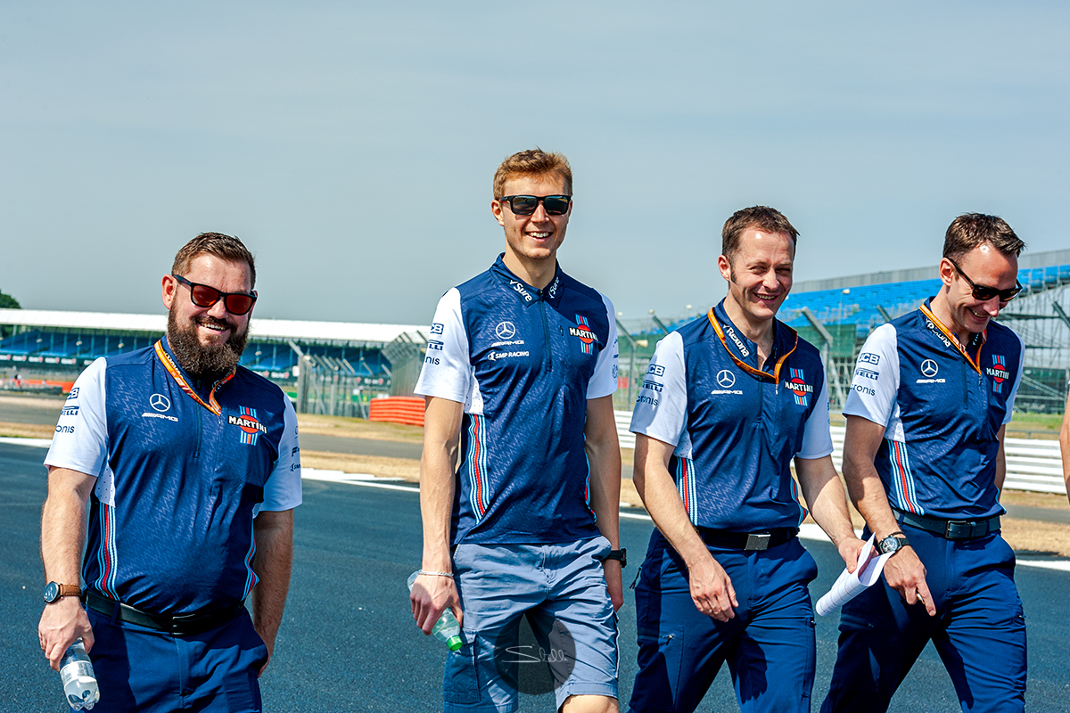  Sergey walks the Silverstone circuit on Thursday morning with his engineers 