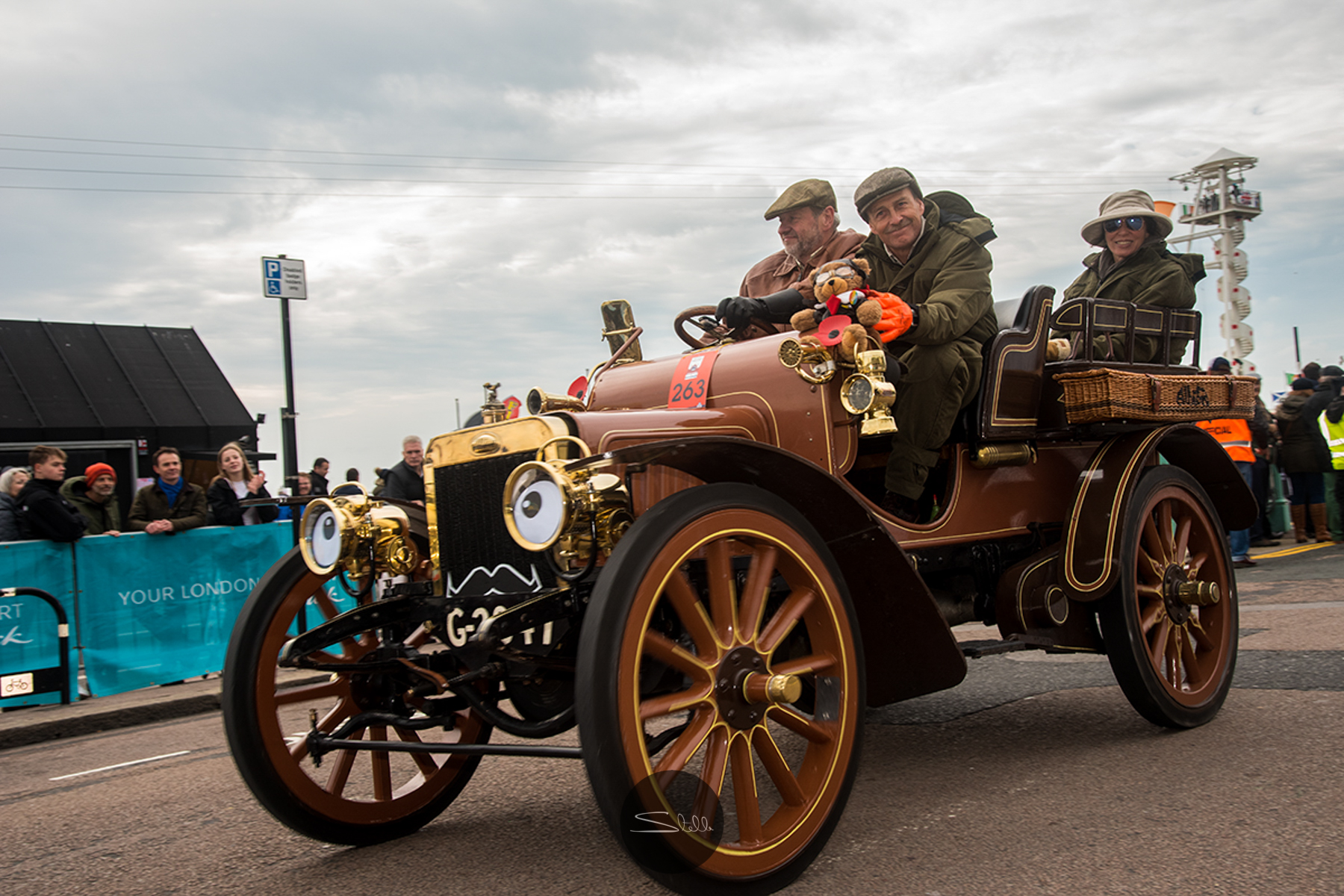  David Pain driving a 1904 Albion 2 Cylinder, 16 HP, with carstache motif in support of Movember and teddy bear mascot. 