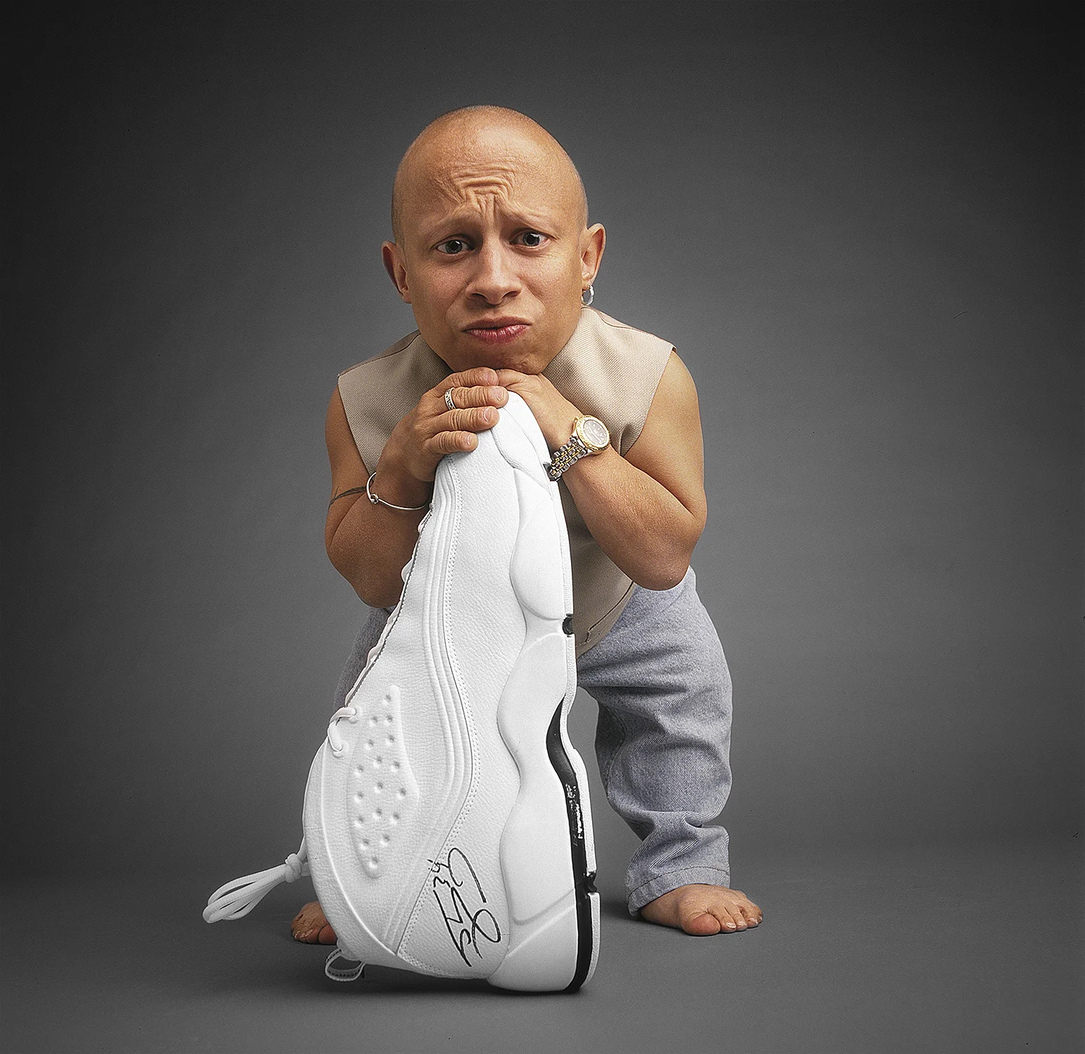 Verne posing with one of Shaquille O'neal's size 22 shoes