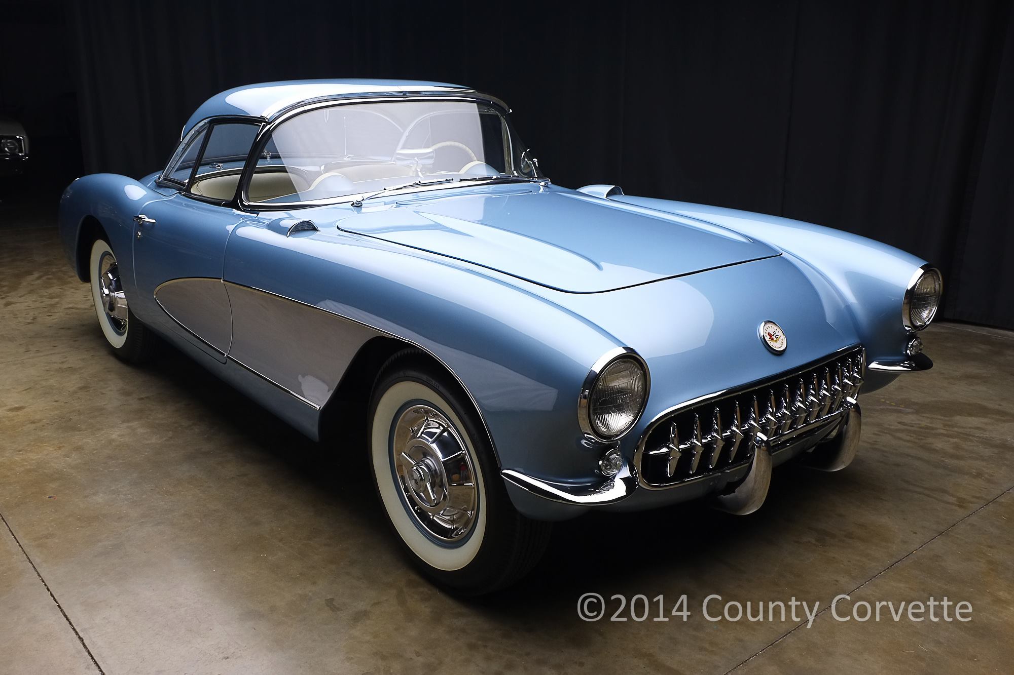  Here is a Concours restored 1957 Corvette. Done in base coat clear coat accurately matching the original Arctic Blue. Thjs type of finish is generally chosen by clients who want a car that looks the best it possibly can. We also improve body gaps an