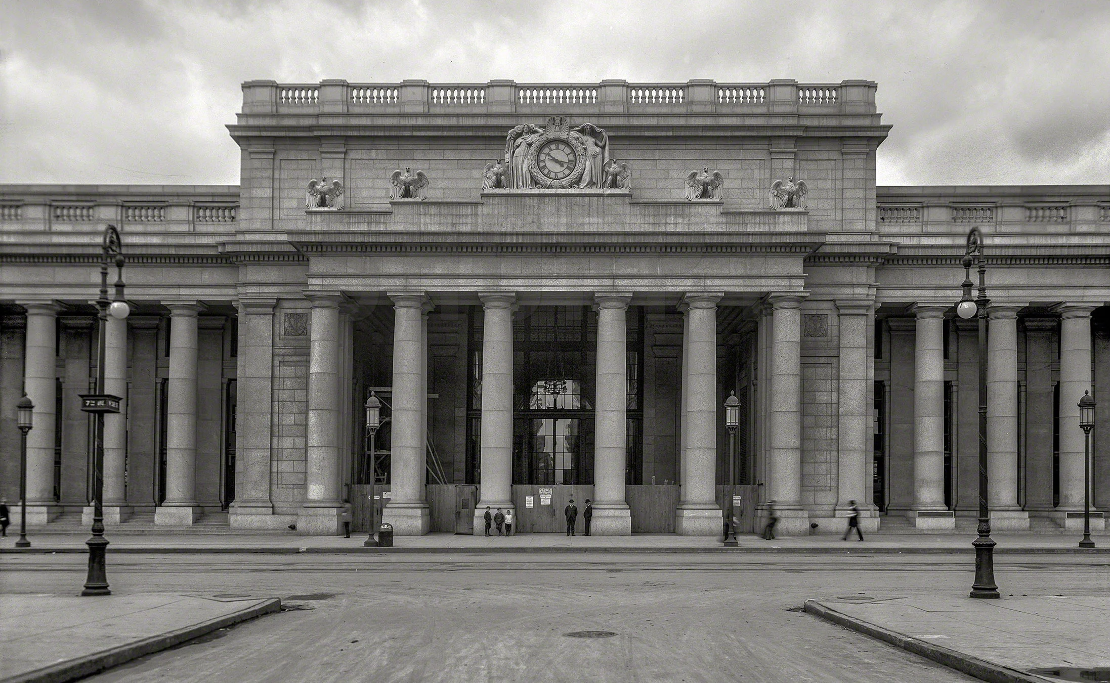 "Night and Day" statues by Adolph Alexander Weinmanatop Penn Station's cornice.