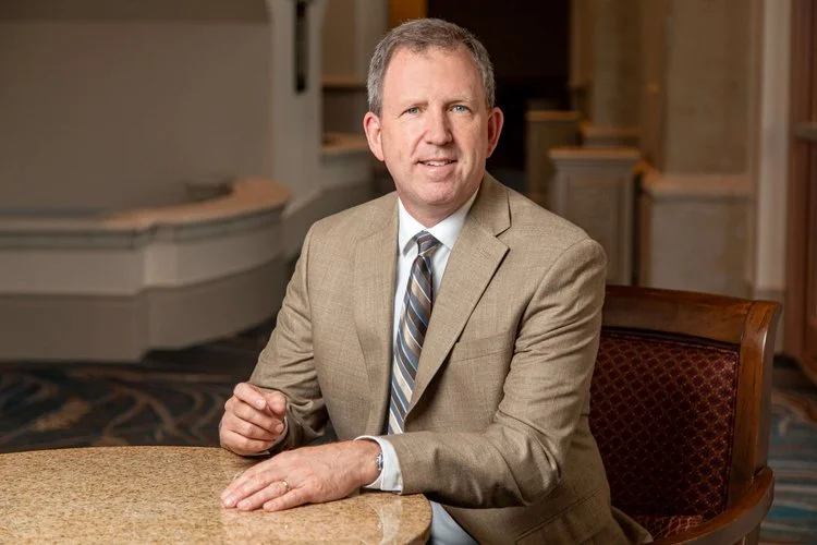 Should you be seated or standing for your business portrait? 