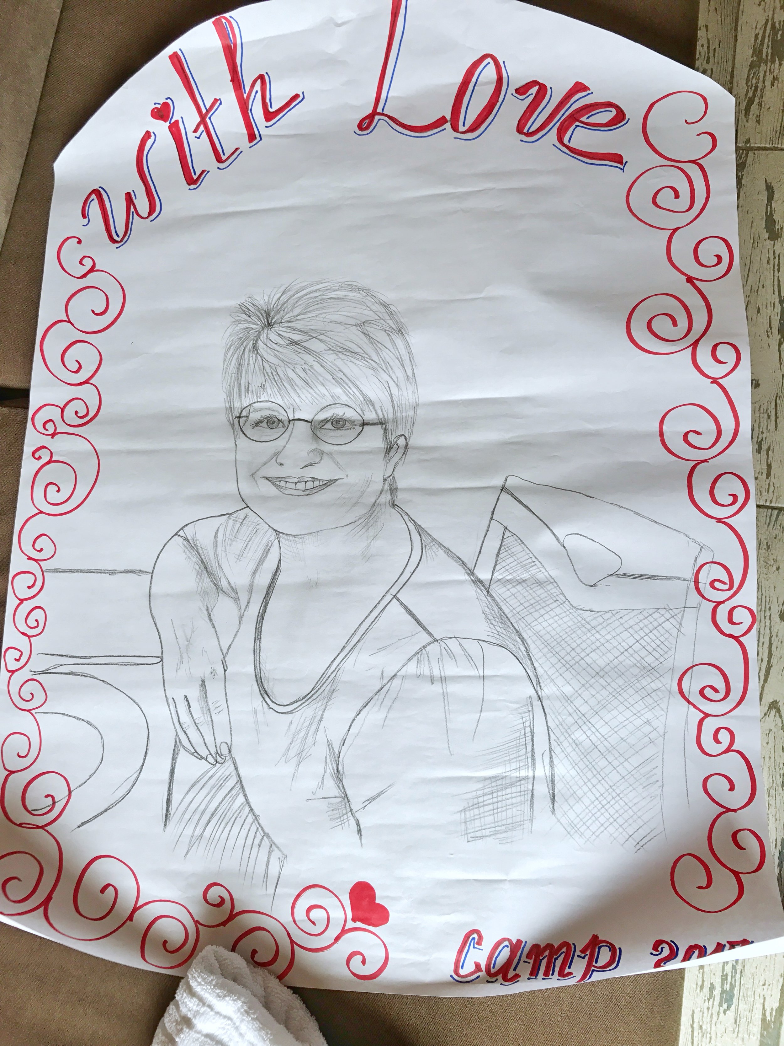 The ladies presented us with gifts.....and one talented young lady even drew our portraits on a large poster. Wow! 