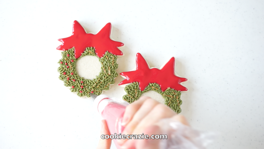  Add red dots to the wreath to represent berries. 