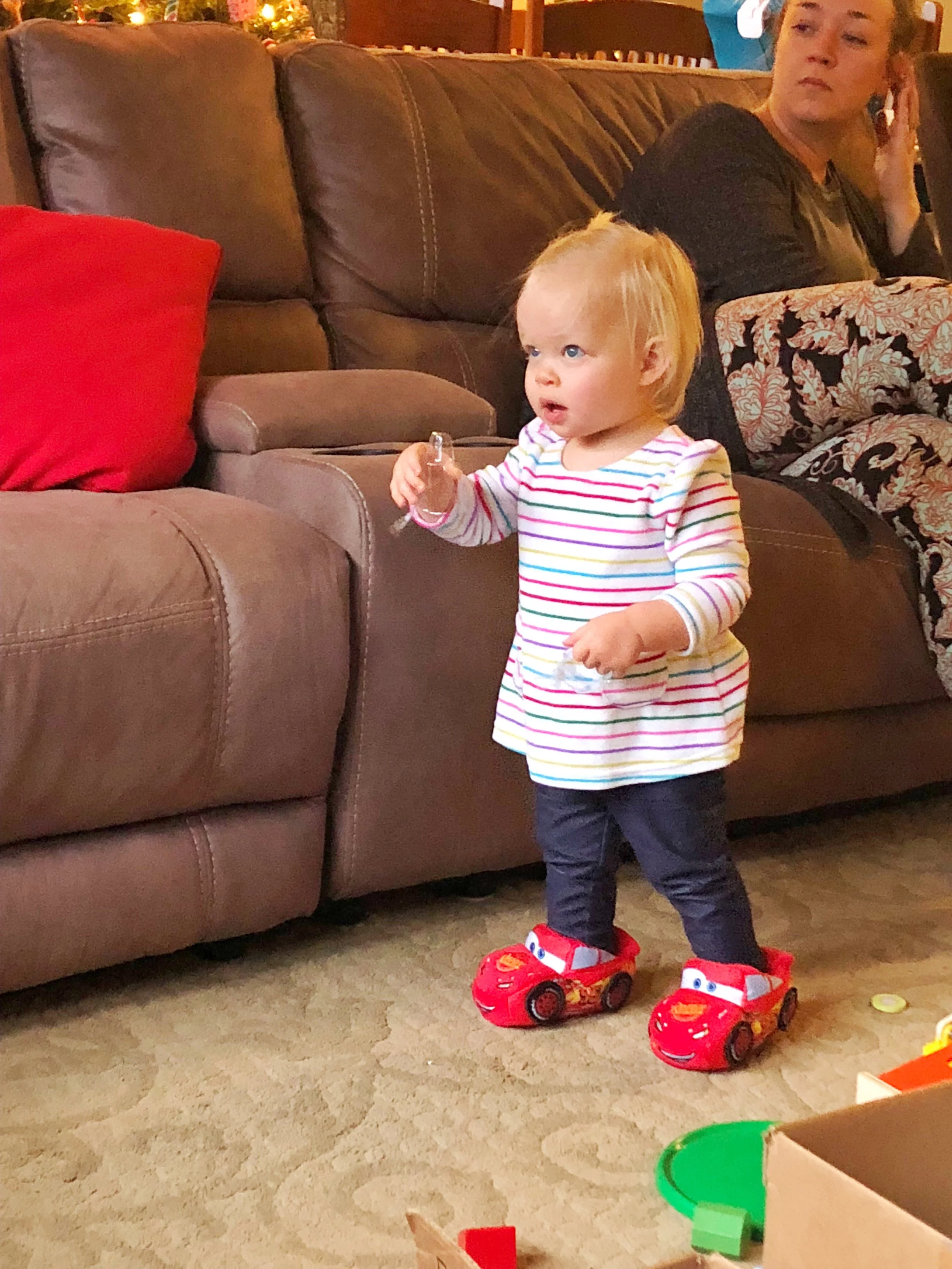 Finn was kind enough to allow Emmy to try out his Lightening McQueen slippers. :)