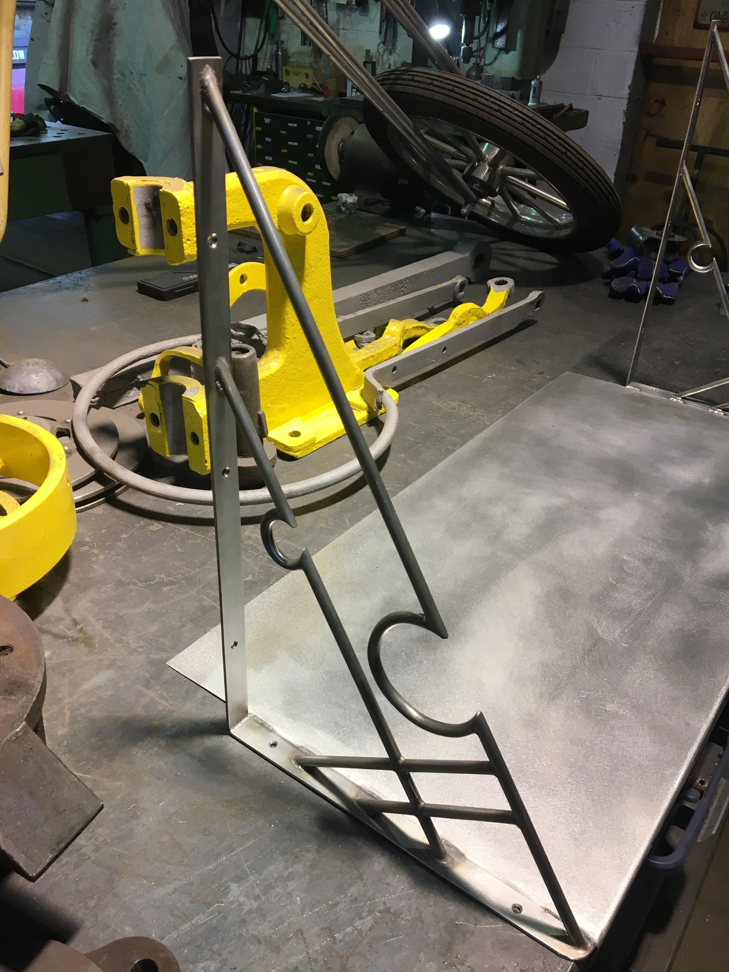 Stainless steel bracket for a shelf at a restaurant.