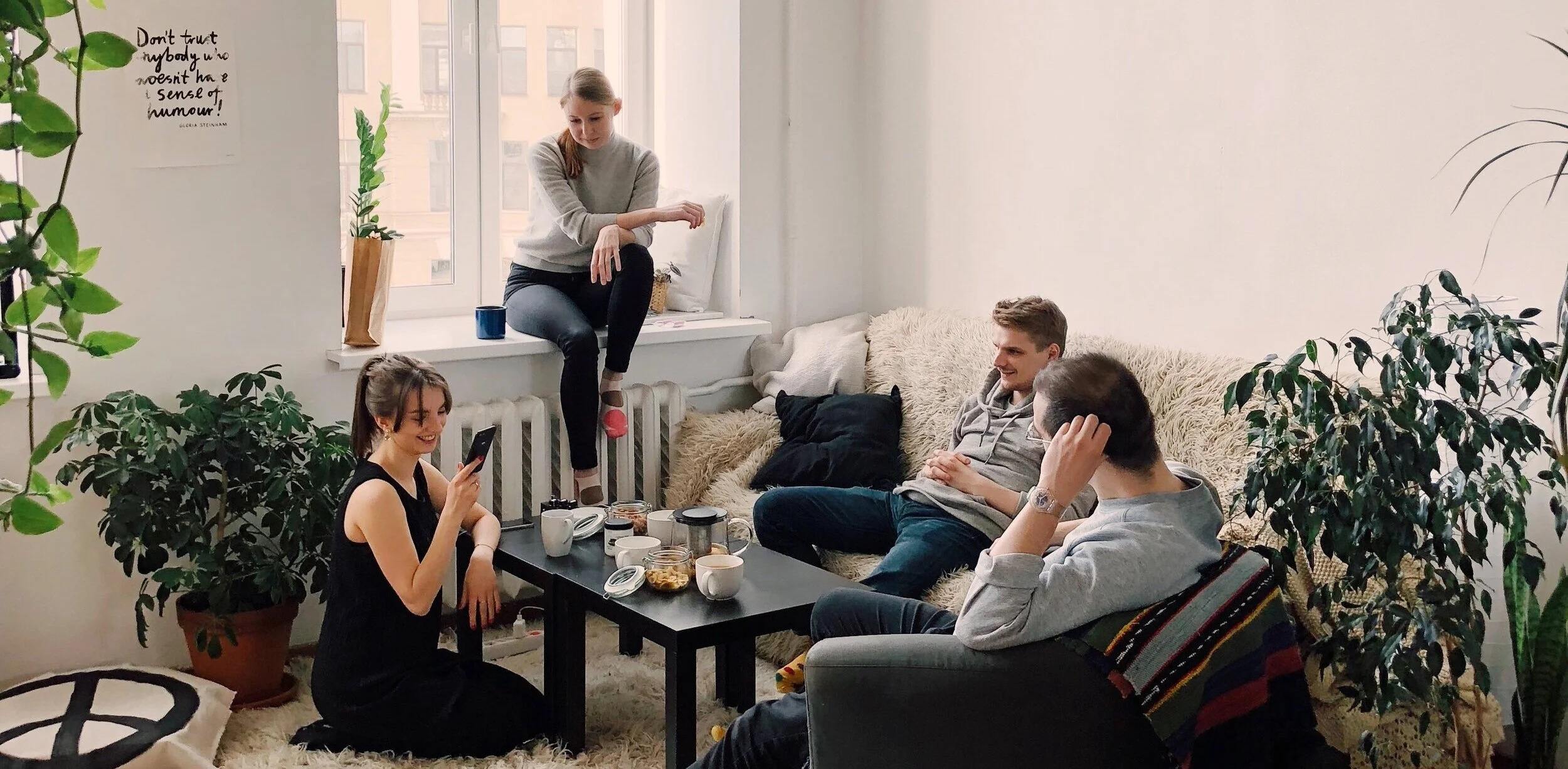 people-gathered-inside-house-sitting-on-sofa-1054974.jpg
