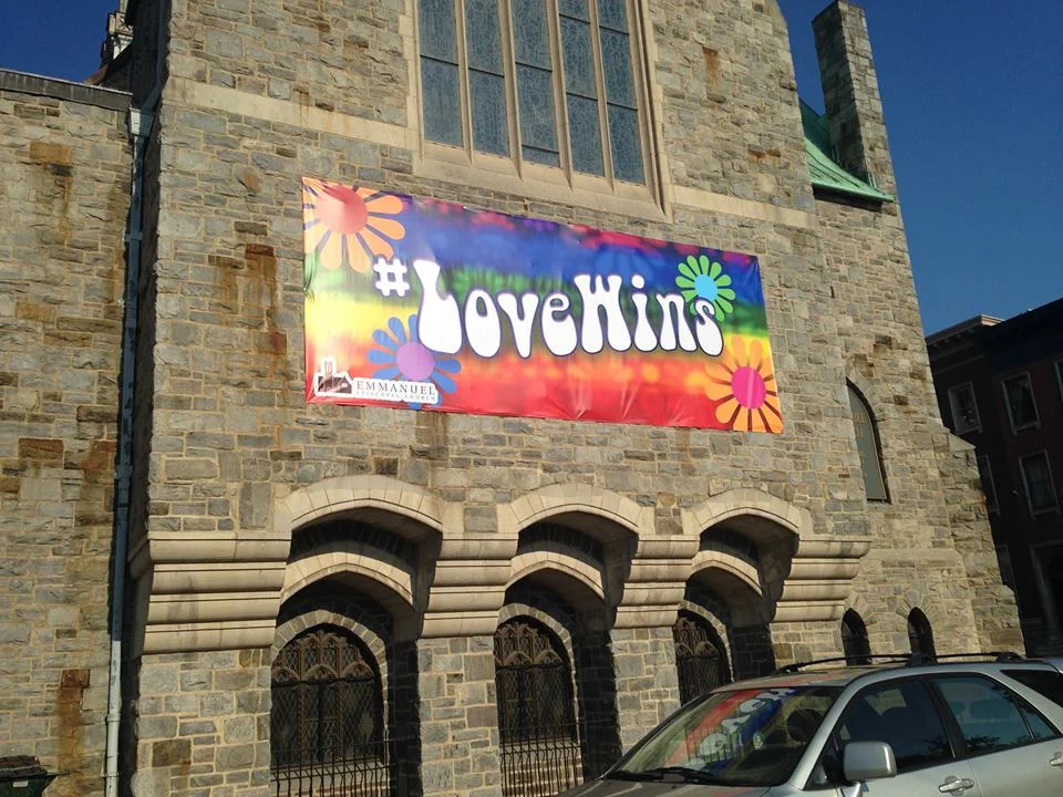 #LoveWins banner facing Charles & Read Streets.