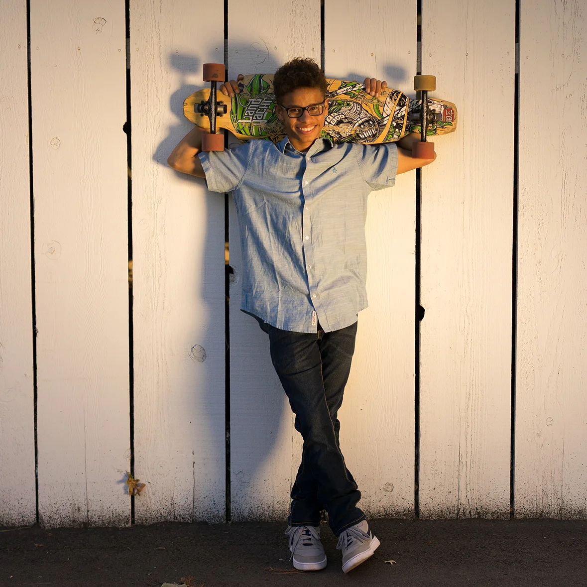 high school graduate with skateboard-Danville lifestyle photography