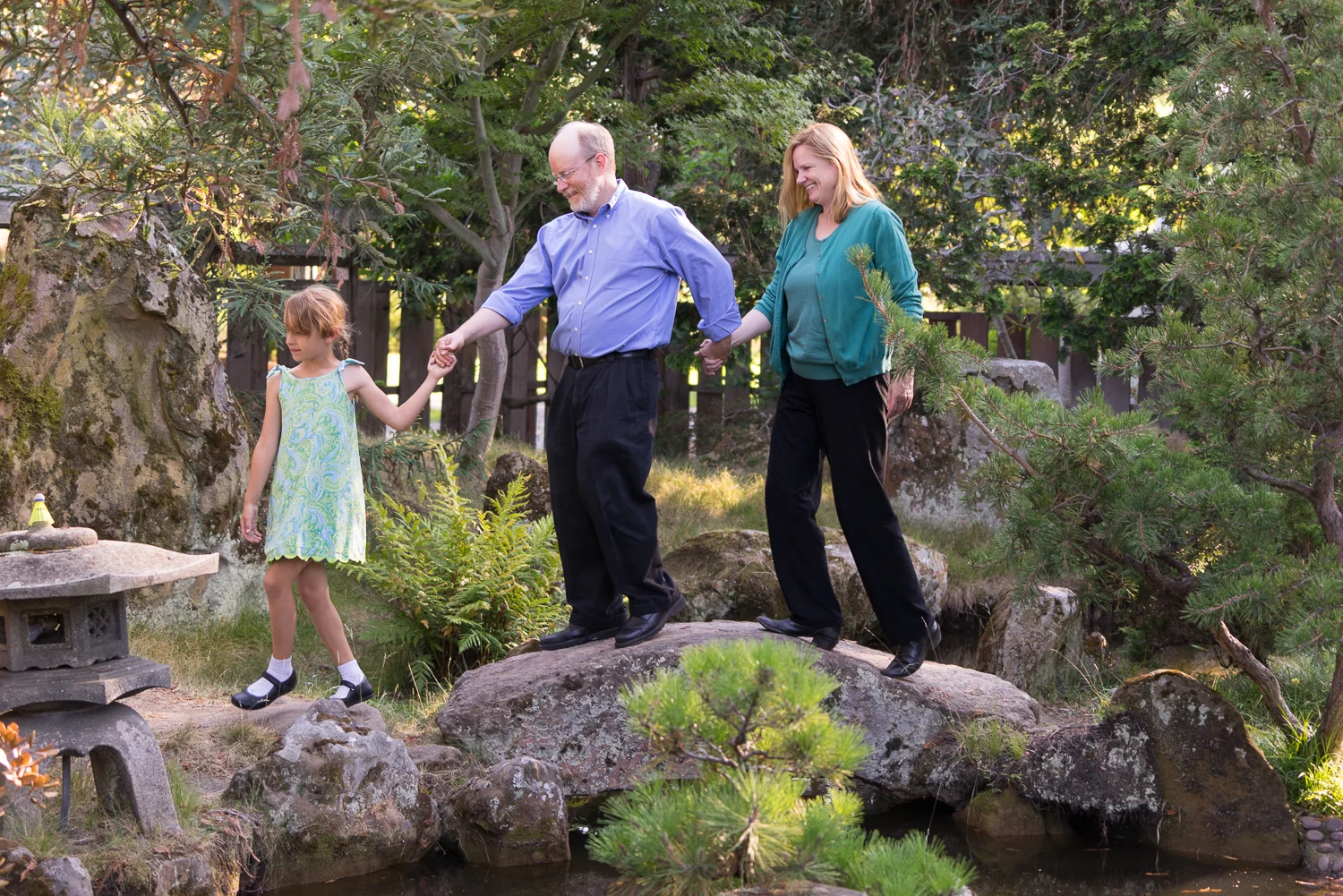 family of three at lake merritt gardens - Oakland family photographer