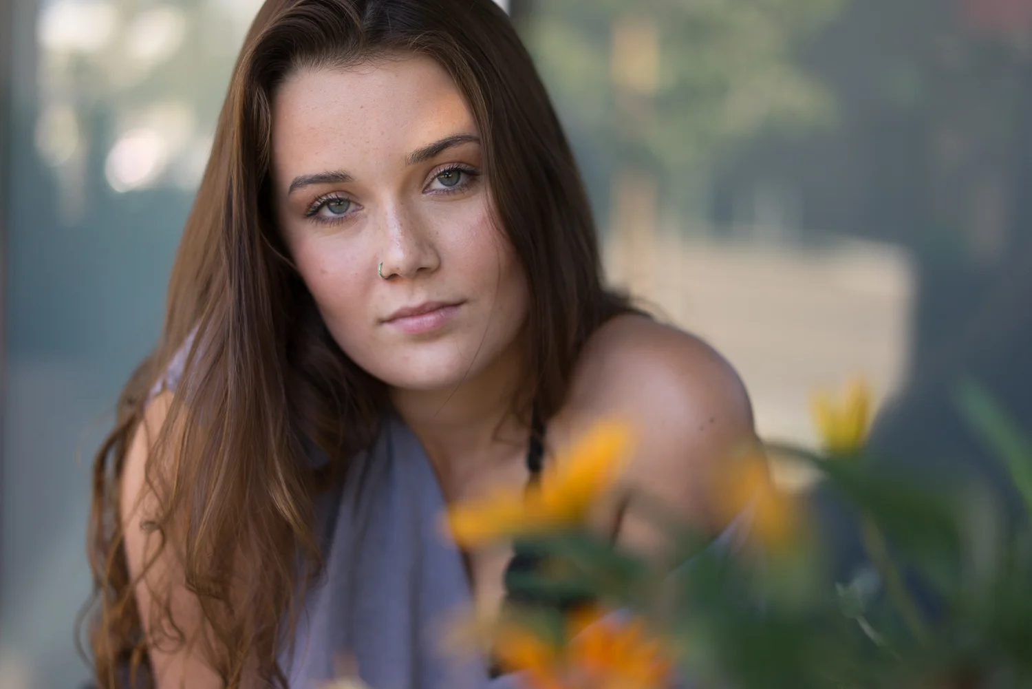teen through flowers - San Francisco Bay area senior portraits
