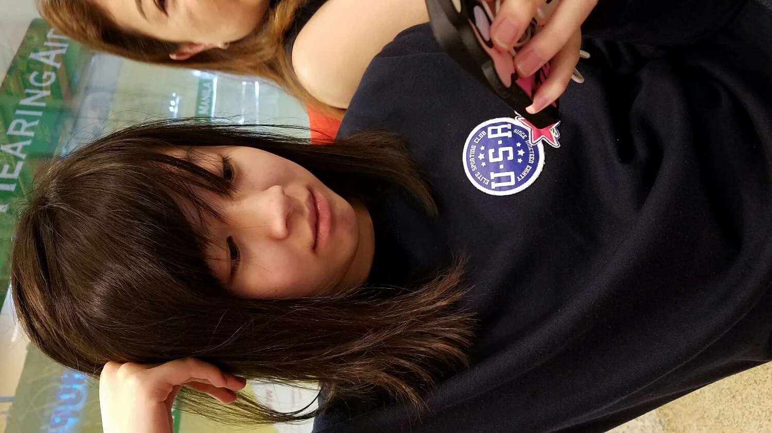 My cute sister waiting for me to finish getting my eyebrows done.