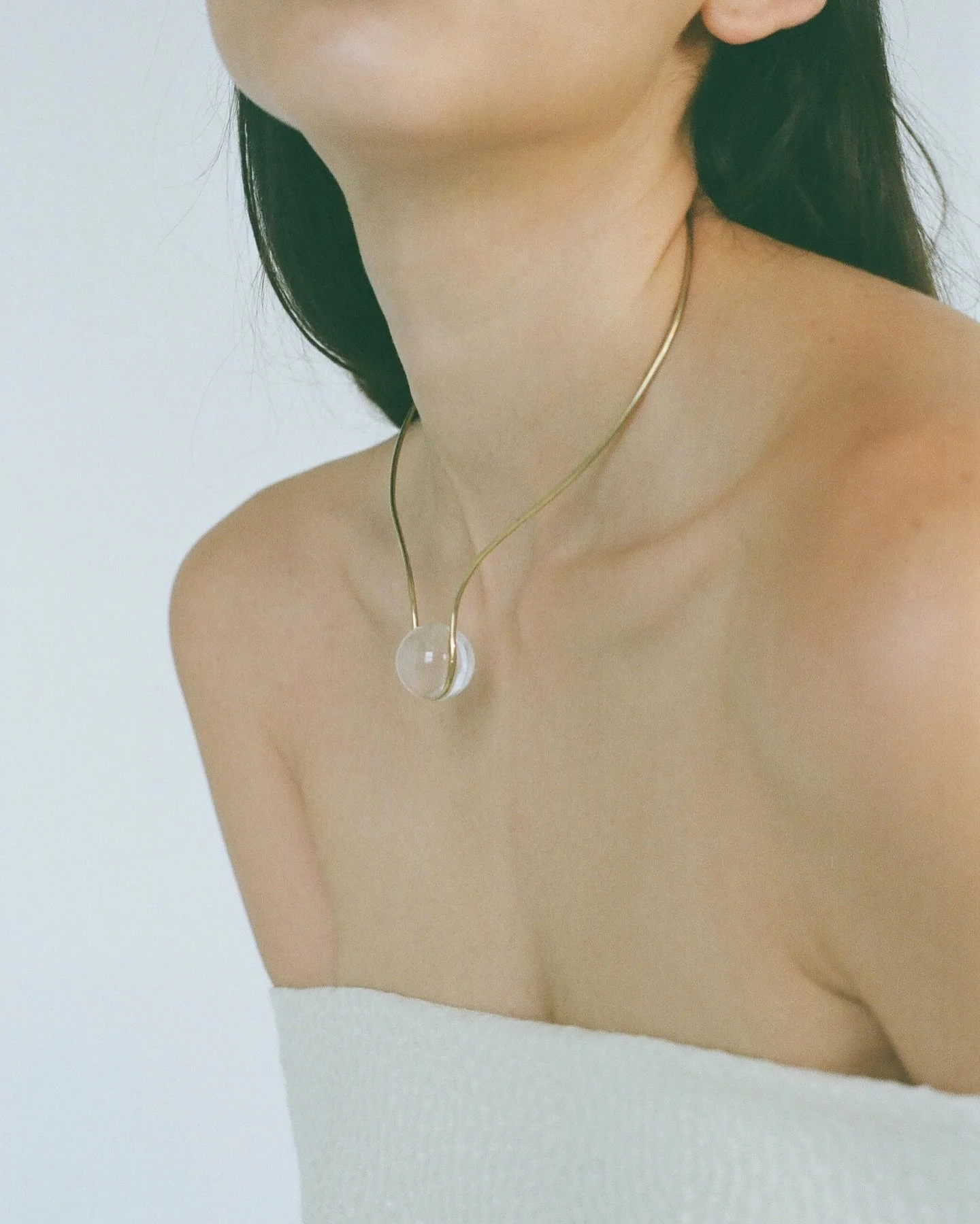 Light-filled, sculptural collar in 14k gold and quartz. The Io Collar is designed for the modern bride.

Shop new light for wedding season and beyond on cyril -studio.com