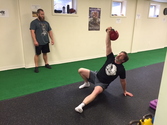 Chris performing a Turkish Get-Up with a 70-lb kettlebell...which is pretty heavy