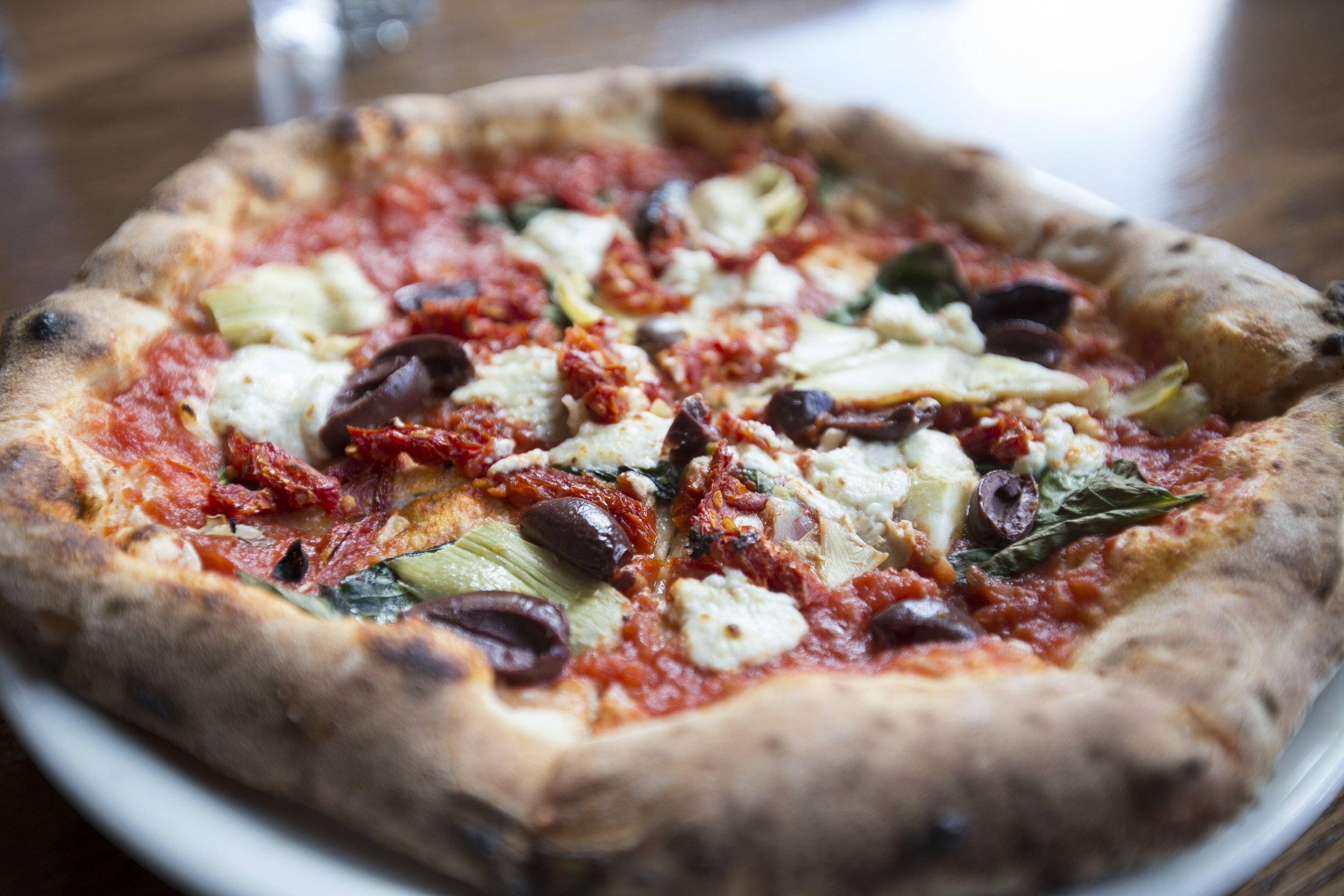  Olivetto pizza made with basil, artichoke, sundried tomatoes, kalamata olives and goat cheese at Pizza Brutta on May 17, 2016 in Middleton, WI.&nbsp; 