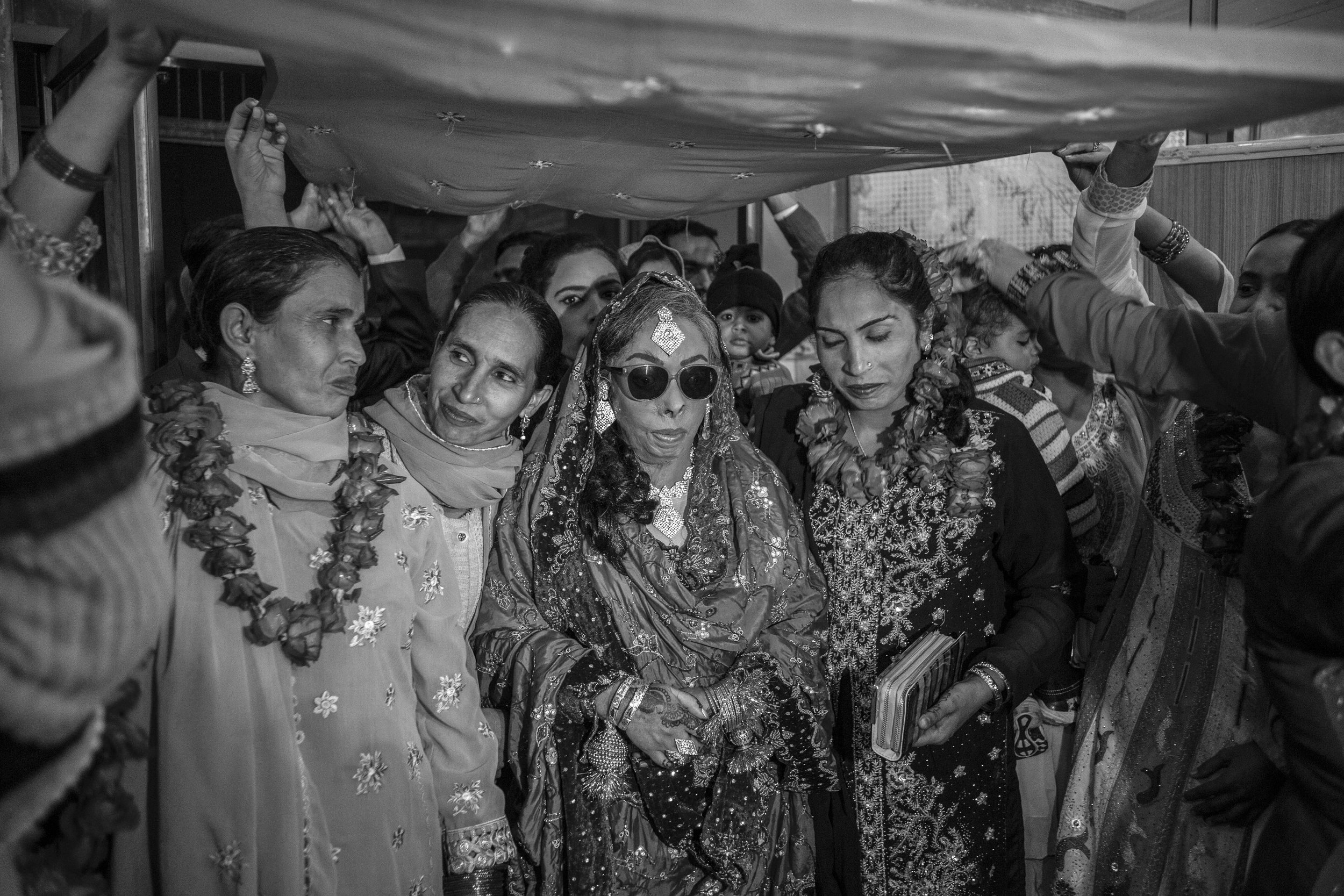  Sarwari Bibi and her sisters walk down the aisle at her wedding ceremony on Jan. 7, 2016 in Lahore, Pakistan. 