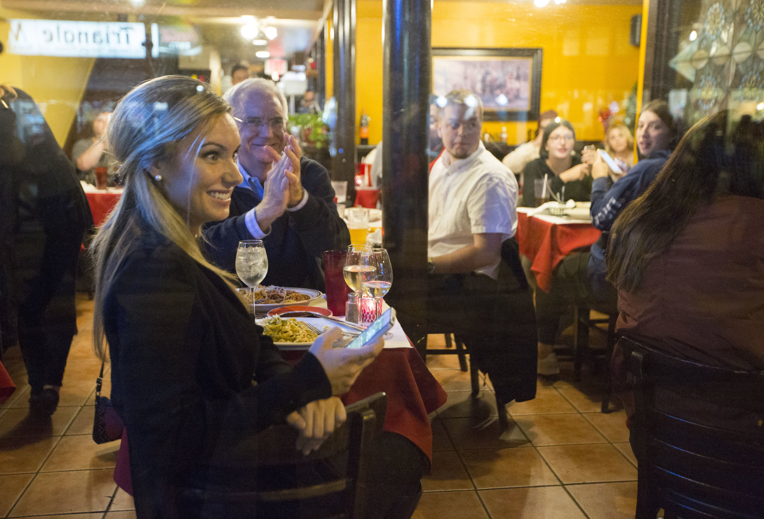  Onlookers inside a restaurant on State Street cheer for the protesters outside during an anti-Trump rally on Nov 10, 2016 in Madison, WI. 