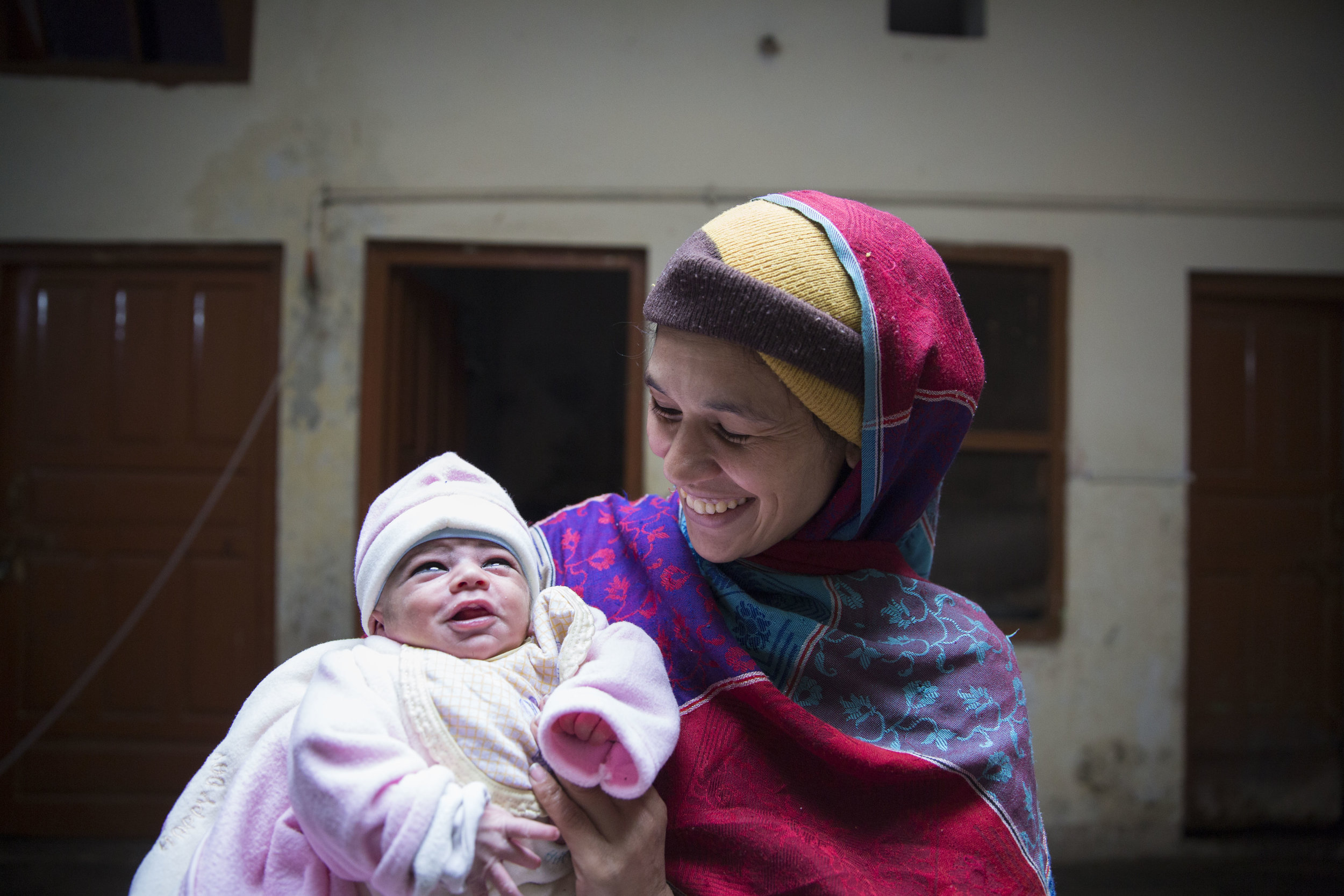  Sobia Sajid along with her newly born baby Ahmed Sajid at their residence after nine days since her delivery where she suffered from postpartum haemorrhaging. 