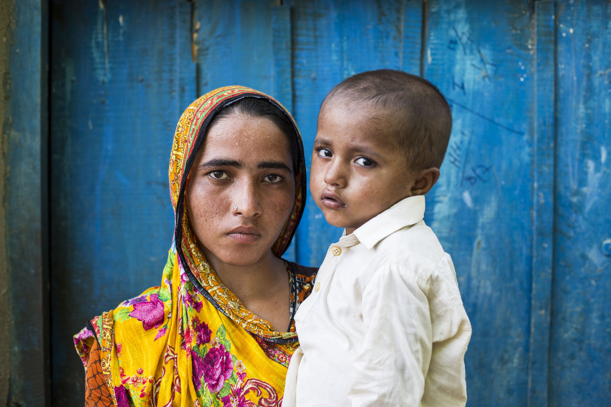  Shamshad, 19-year-old holds her 3-year-old son Waqar Ali, who has been diagnosed with HIV in Subhani Shar village, around 8 km from Ratodero on July 25, 2019 in Sind, Pakistan.  