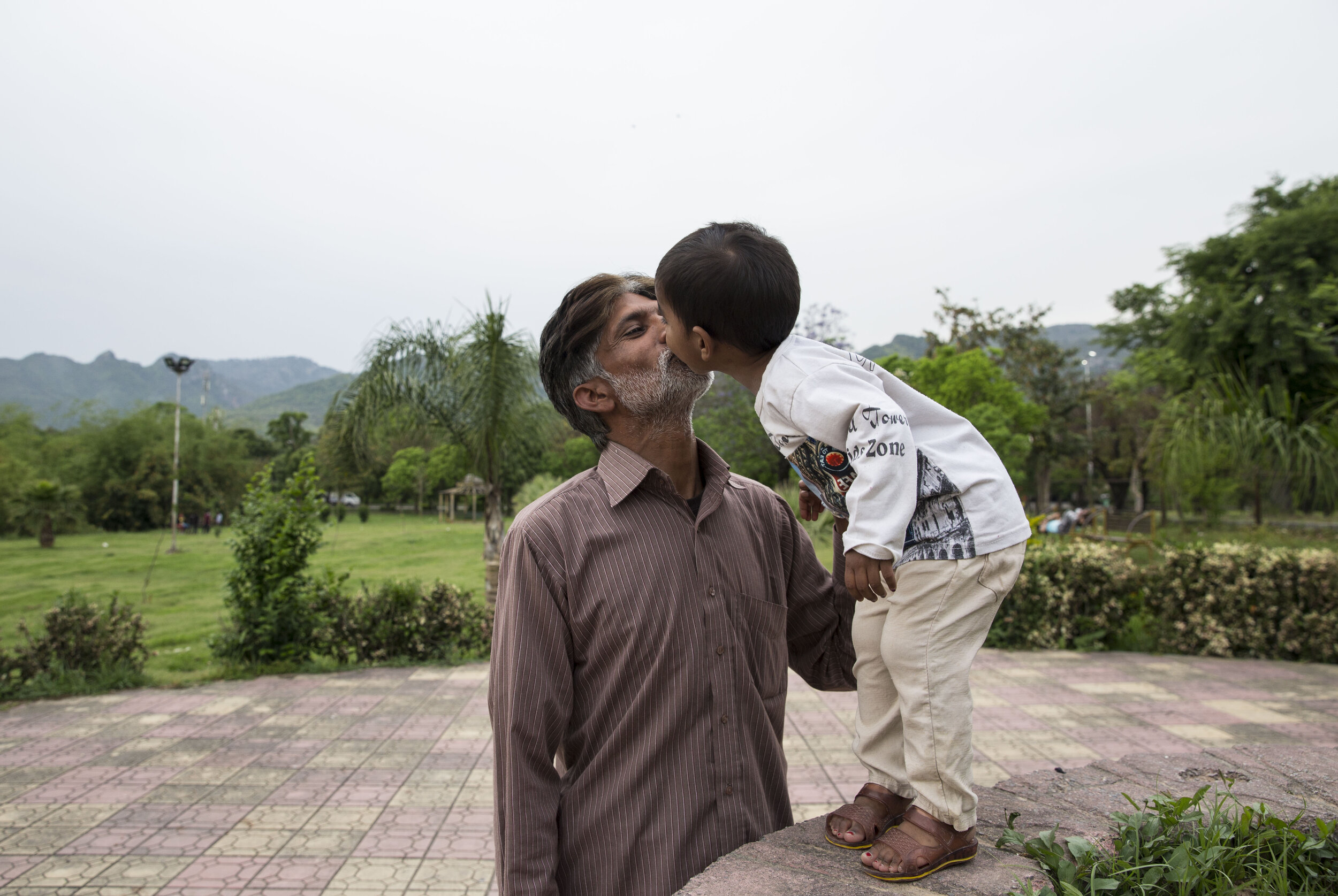  Arif Masih kisses his 2-year-old daughter Cynthia at the park, an activity they do everyday under the lockdown. 