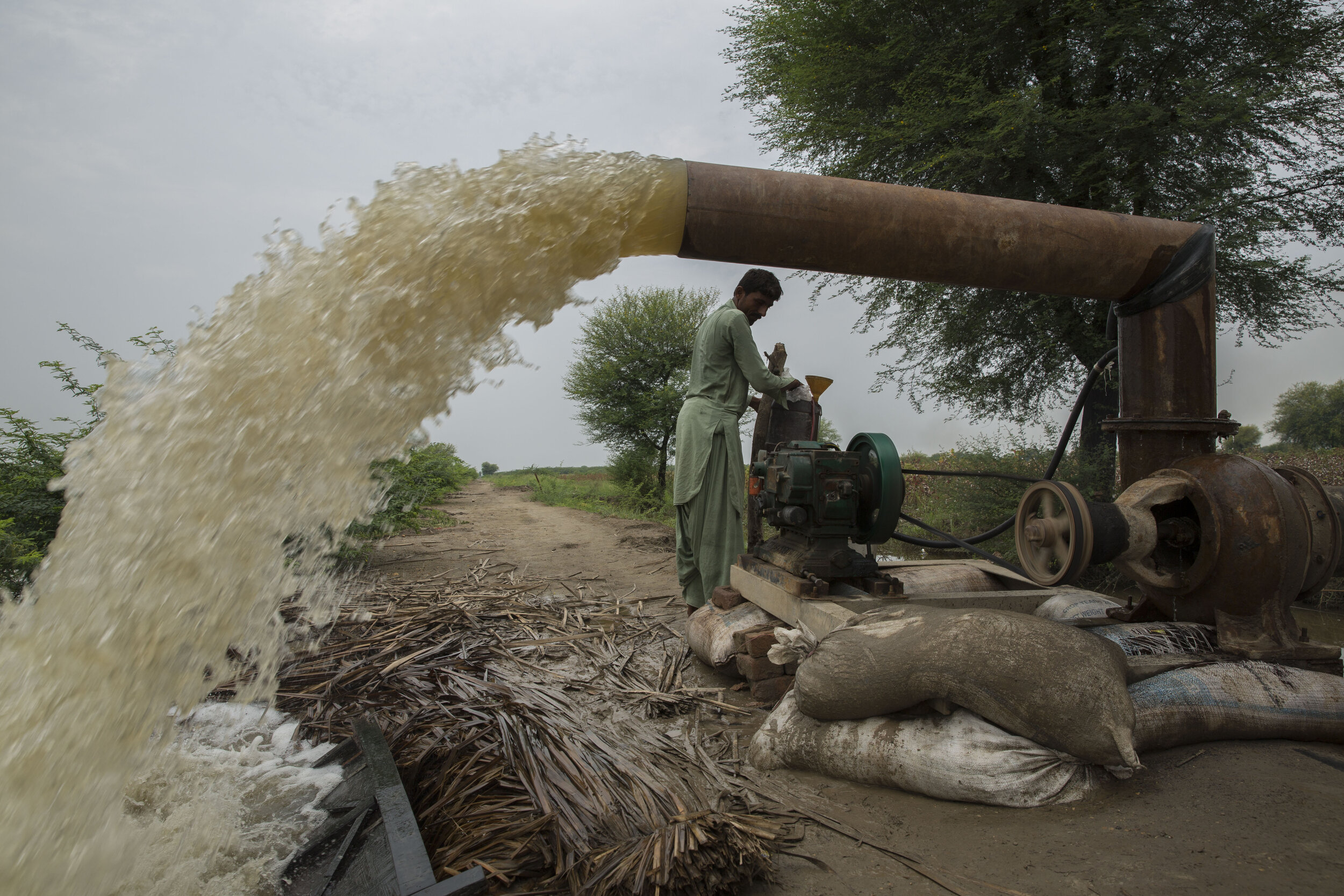  Allah Dir pumps out water out of their crop along with other farmers whose crop has been damaged. With winter coming and all their crops destroyed these villagers have nothing to eat but no way to rebuild their homes either. 