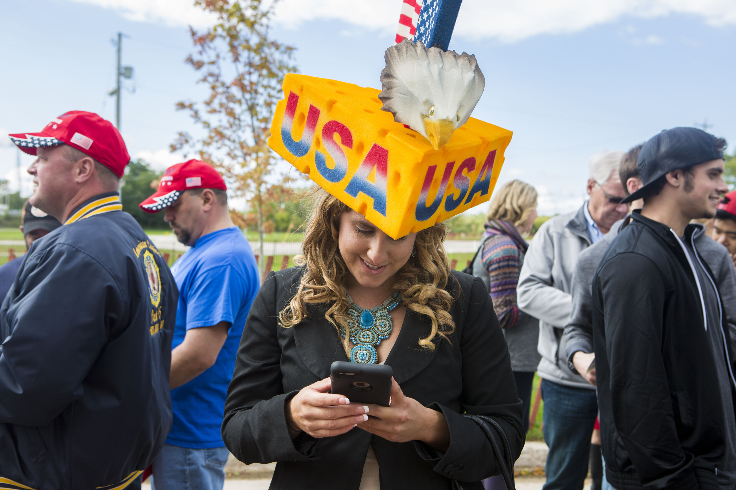  Erica Smith wears a "cheesehead" hat outside Donald Trump's rally. 