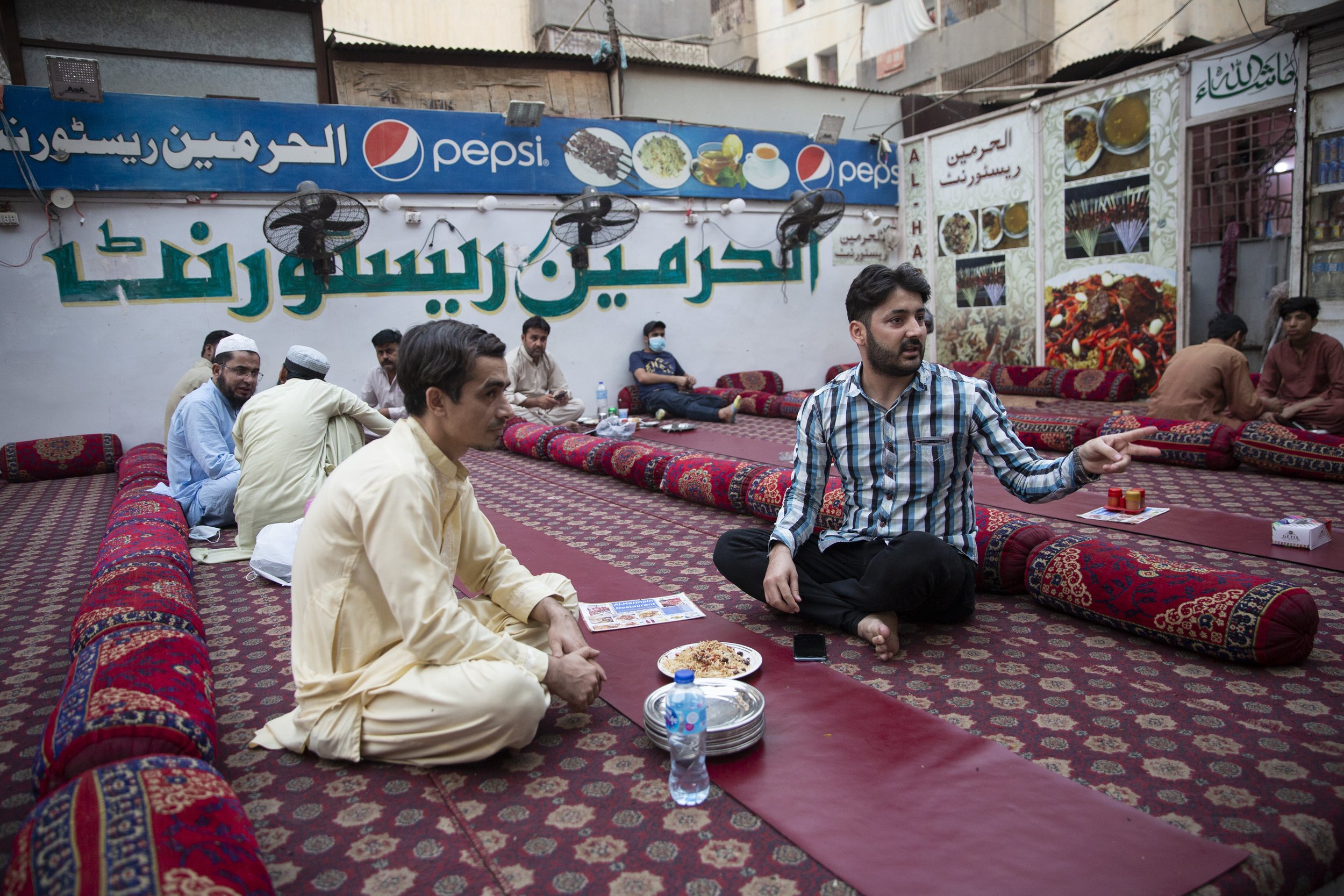  Muhammad Salim, eats dinner with a friend at an authentic Afghan restaurant. 