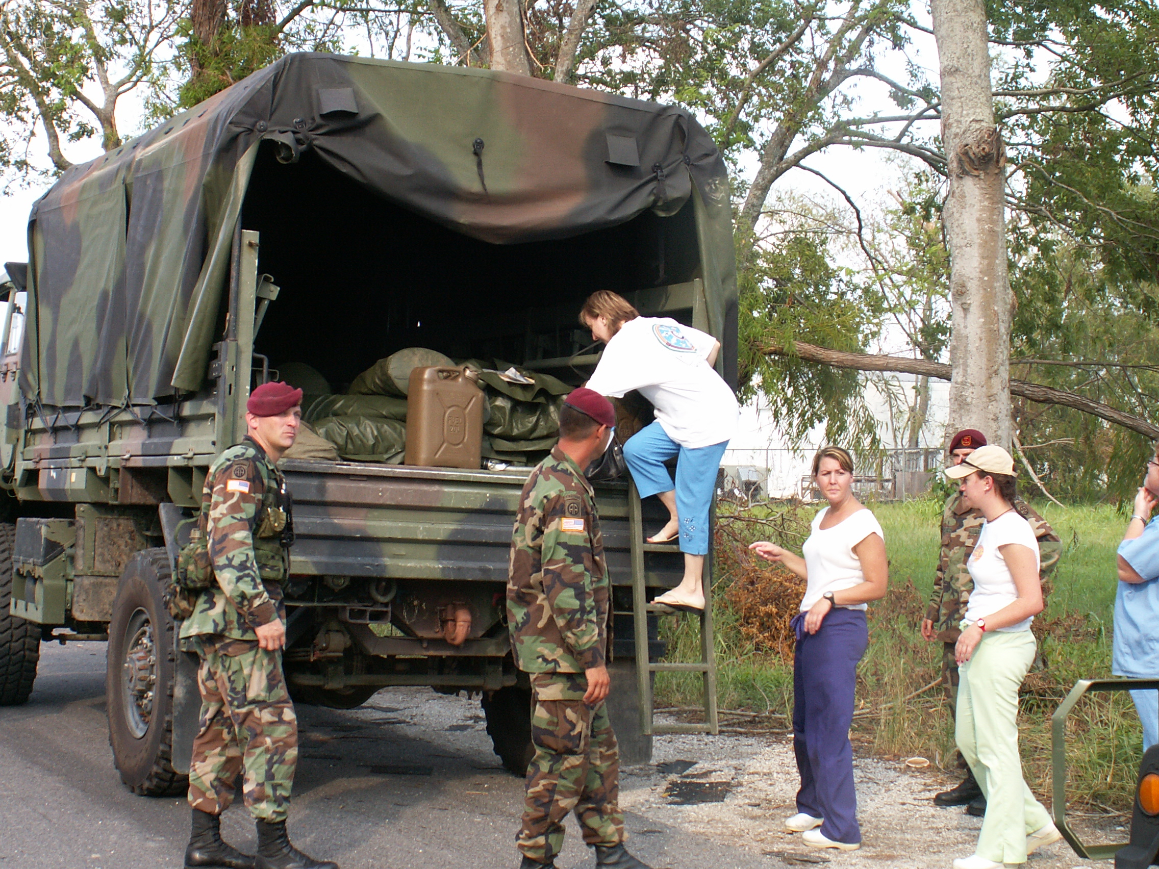 Hope International volunteers distributing essentials