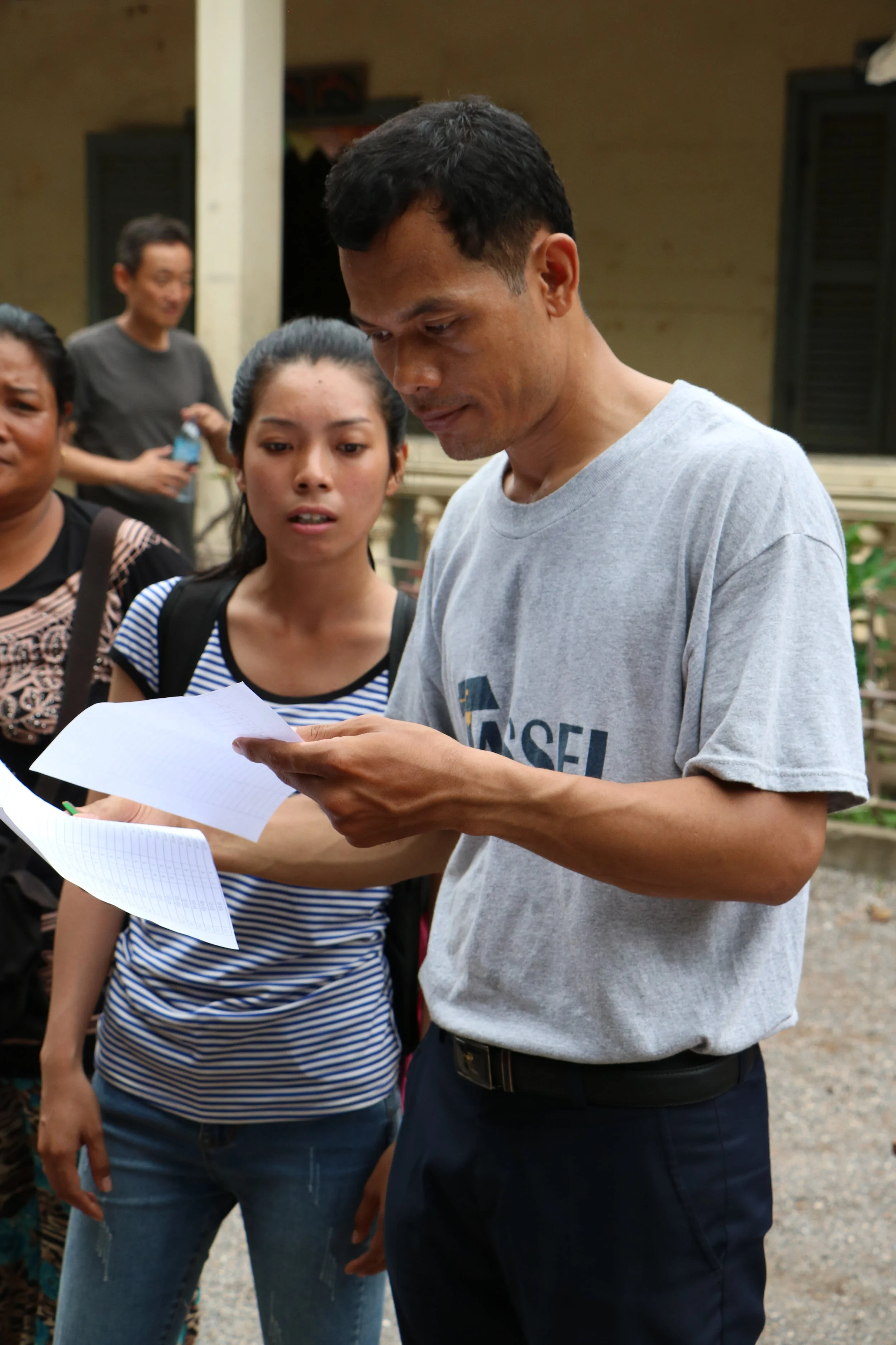 Teacher Noeng configuring medicine distribution at the Kamping Puoy TASSEL School, 2016.