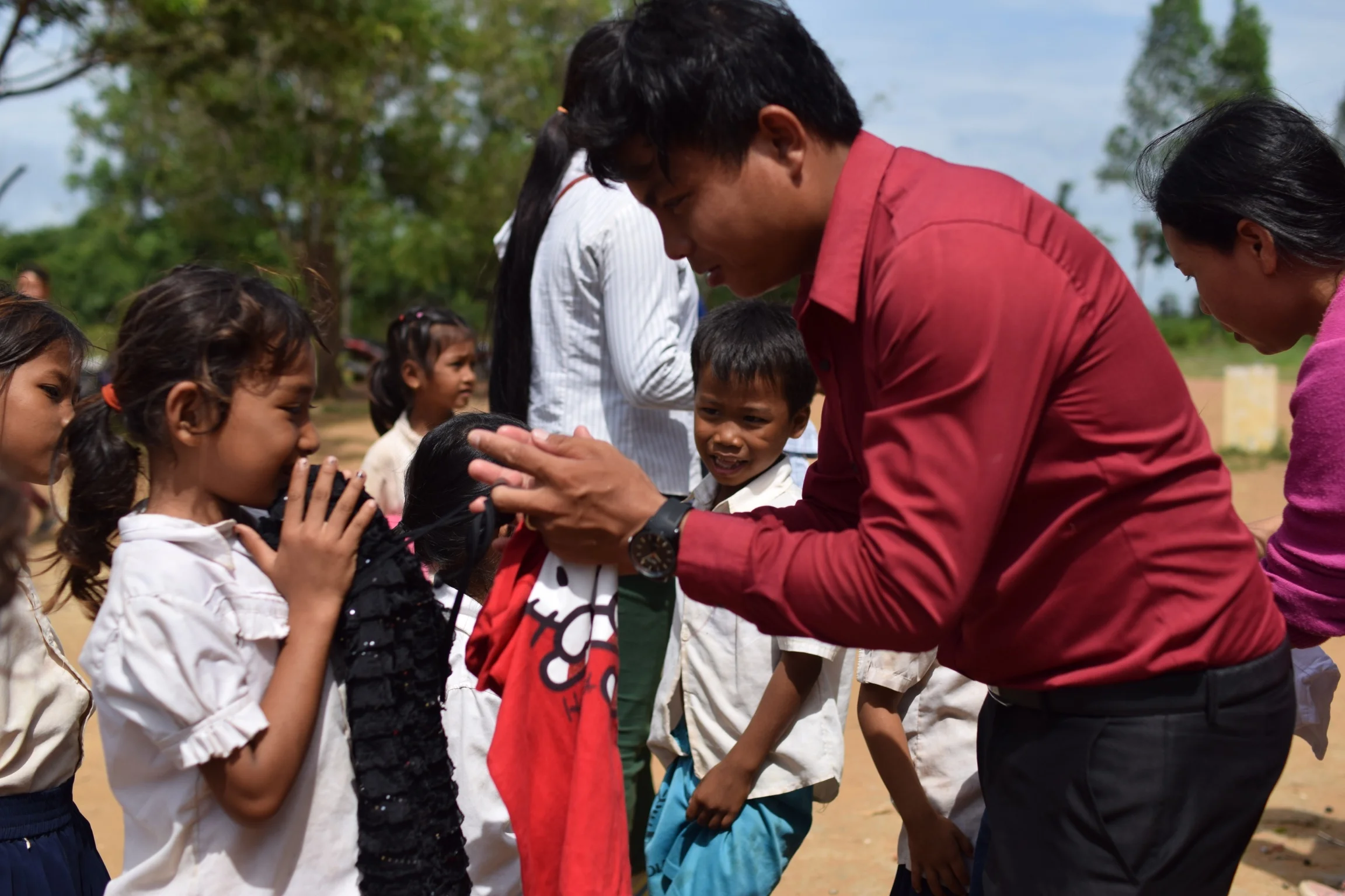 Delivering medicine to children at the Kamping Puoy TASSEL School