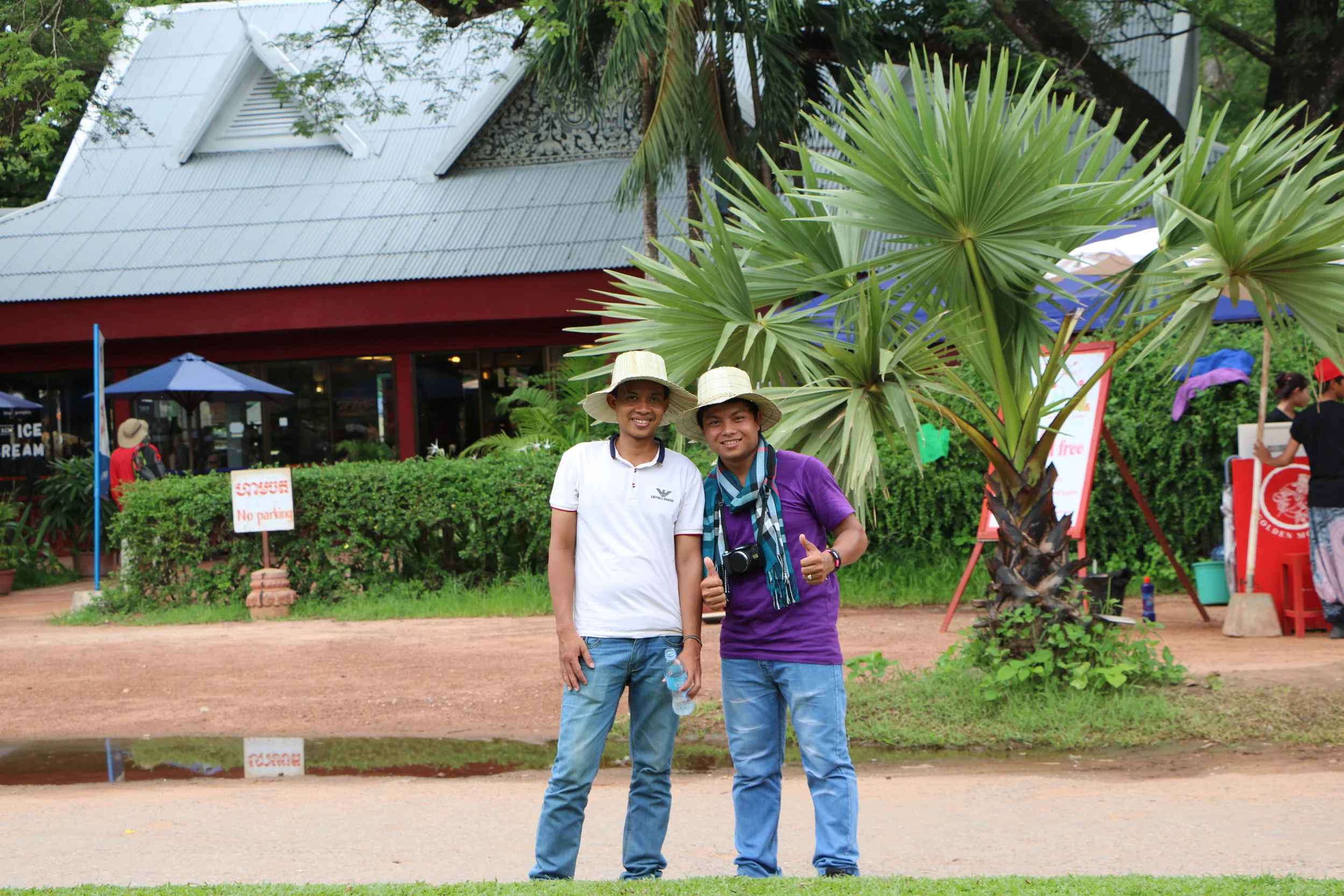 Teacher Samnieng and Teacher Samath visiting Angkor Wat, 2016.