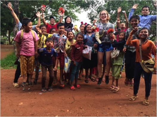 Seisen chapter volunteers posing for a photo with their students at the TASSEL school. 