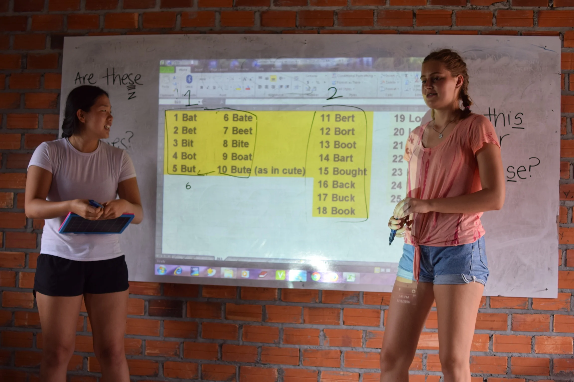 Sophia Lee (left) teaching at the Samrang TASSEL School during a summer 2016 TASSEL trip.