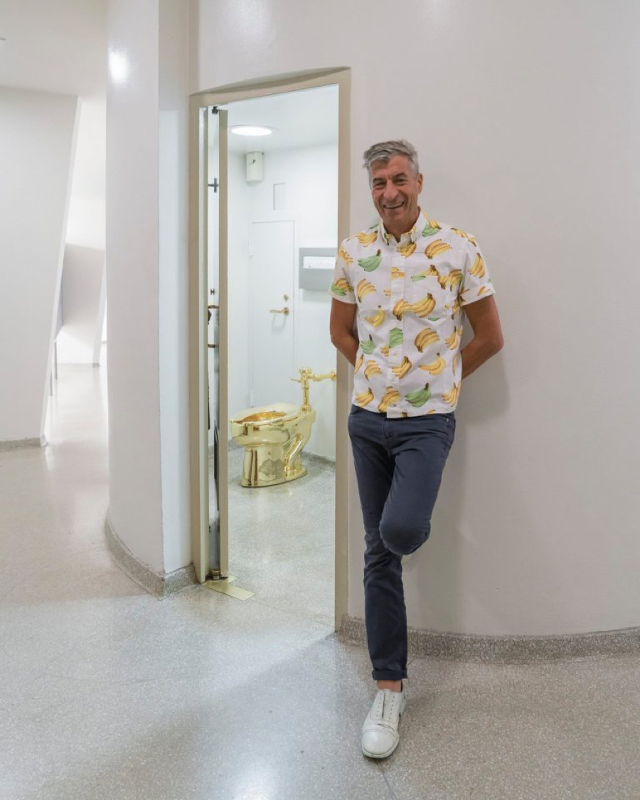 Maurizio Cattelan with his sculpture America t the Solomon R. Guggenheim Museum.