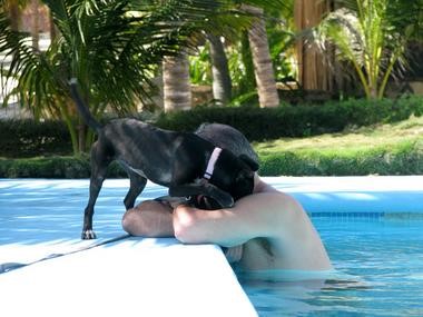 Nuzzling dad by the pool at my Aunt Laura's Hotel Akumal Caribe.