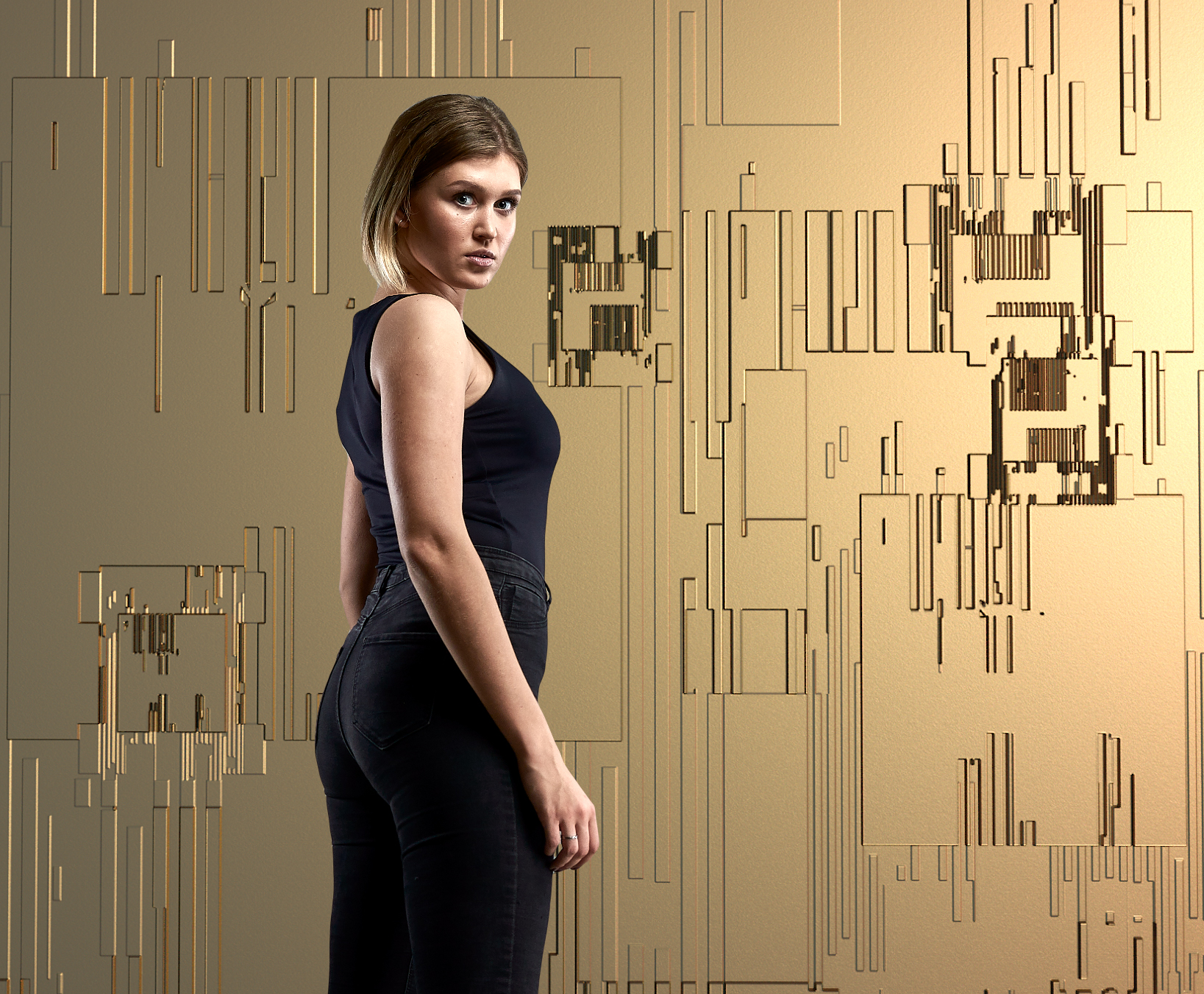 Martyna Motiekaite on a golden high-tech pattern backdrop.