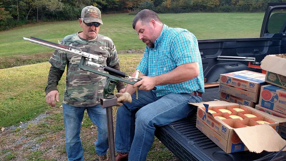 NBC Sportsman, Joey Newell, loads the Clay Bird thrower as the men line up to take their shot at "Skeet" Shooting.