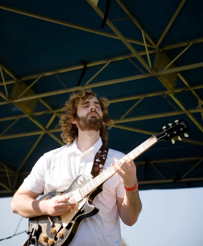 Fletcher's Grove guitarist Wes Hager is feelin' the music at the First Annual WV Food Truck Festival , earlier this year. You can check out Fletcher's Grove (appalachian jam rock from Morgantown, WV) Thursday night at Casa Nueva in Athens. Photo by Michelle Waters