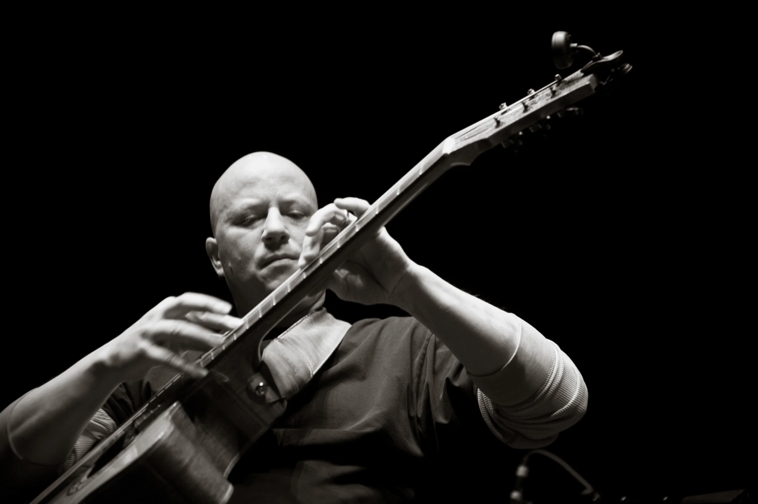 Spencer Elliott 's unique guitar playing style will be featured alongside Ethan Ian Case , this coming Saturday at Charleston's Clay Center . Photo by Michelle Waters