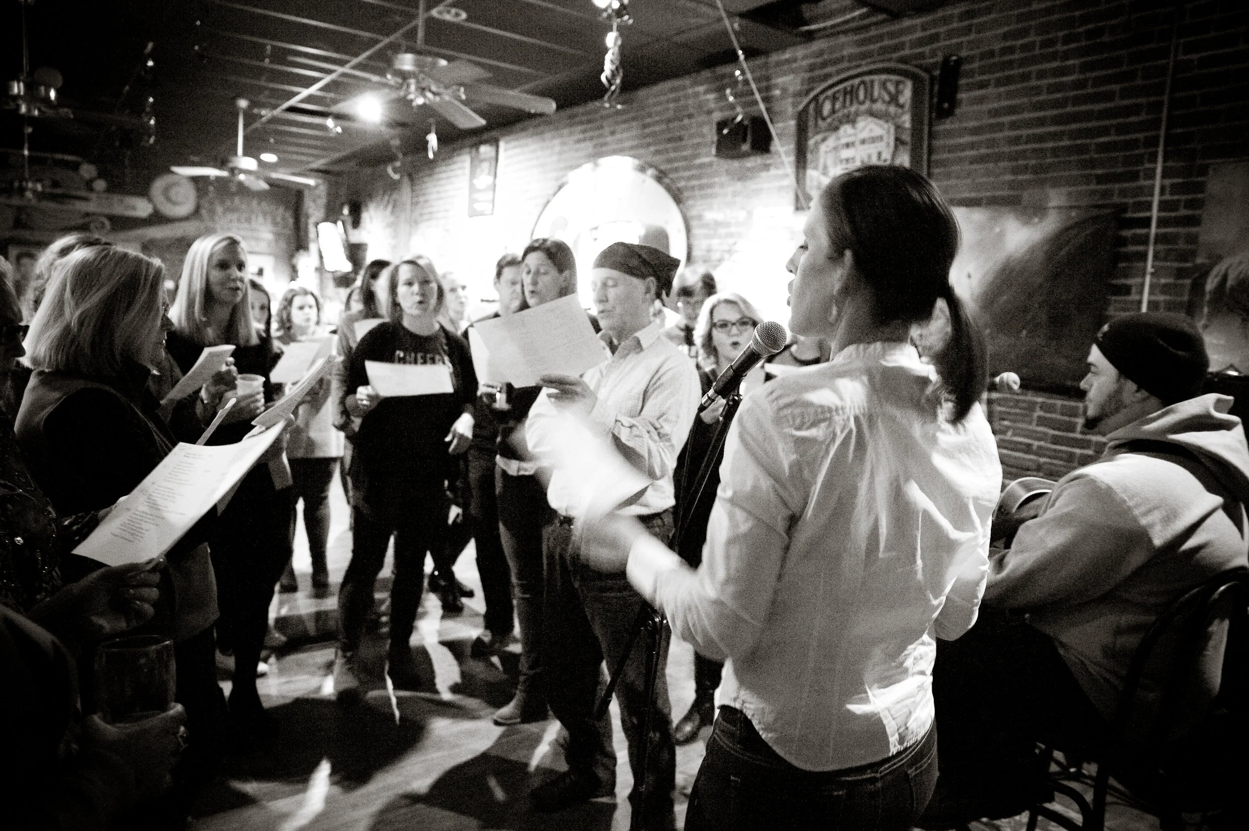 Audience participation is highly encouraged at ChoirNow WV . This week, join the gang at Sam's Uptown Cafe while they sing Hallelujah in several part harmony! Learn more about ChoirNow in an upcoming story, this week. Photo by Michelle Waters . 
