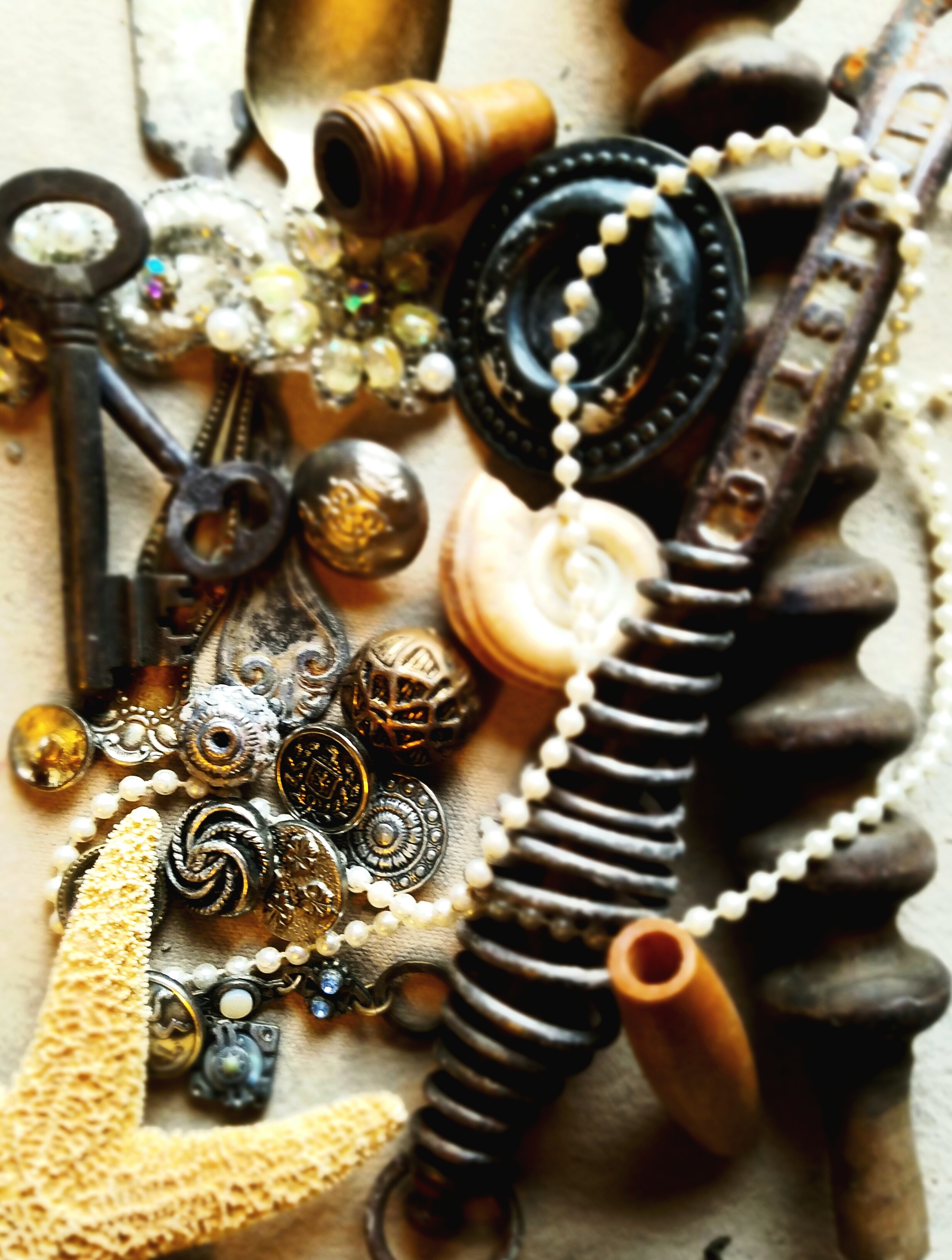 ANTIQUE KNICK KNACKS AND SHELLS PROVIDE TEXTURE TO MY PIECES.