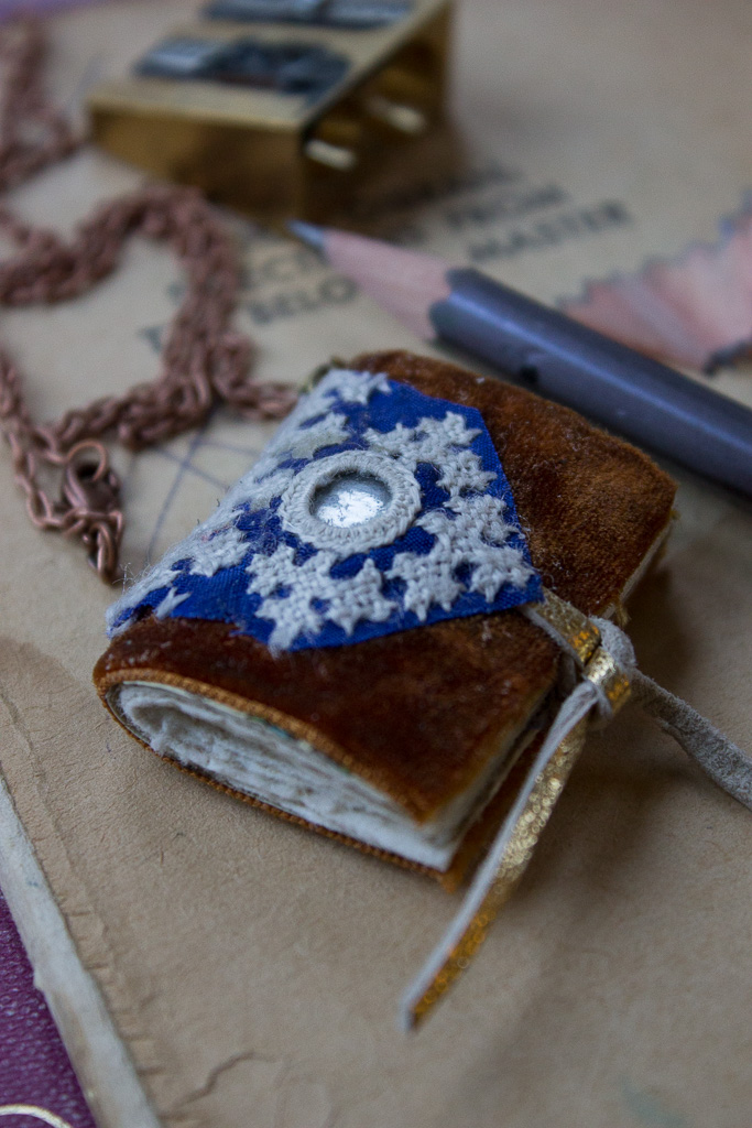 Book necklace with vintage embroidery