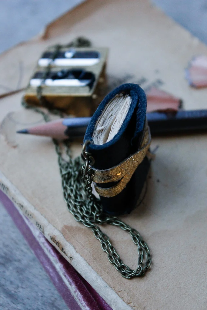 reclaimed navy blue leather book necklace