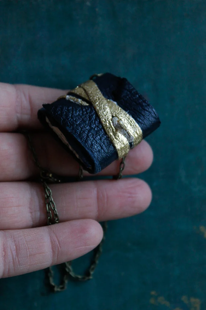 reclaimed navy blue leather book necklace