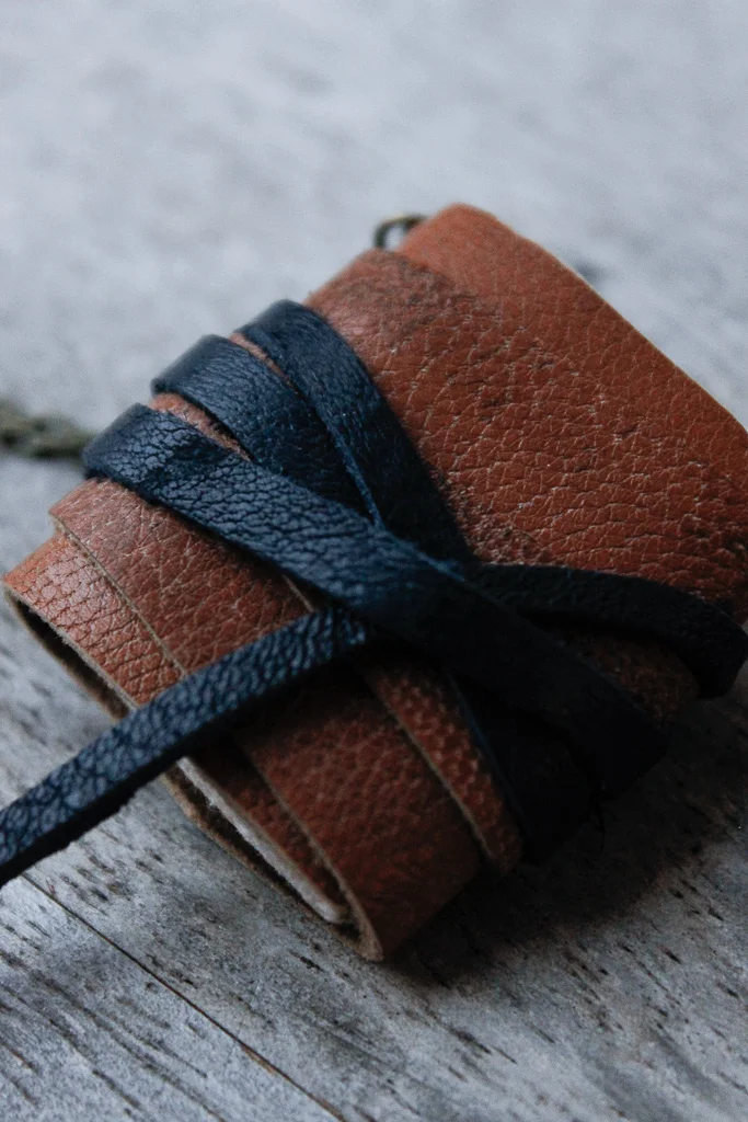 Tan leather book necklace