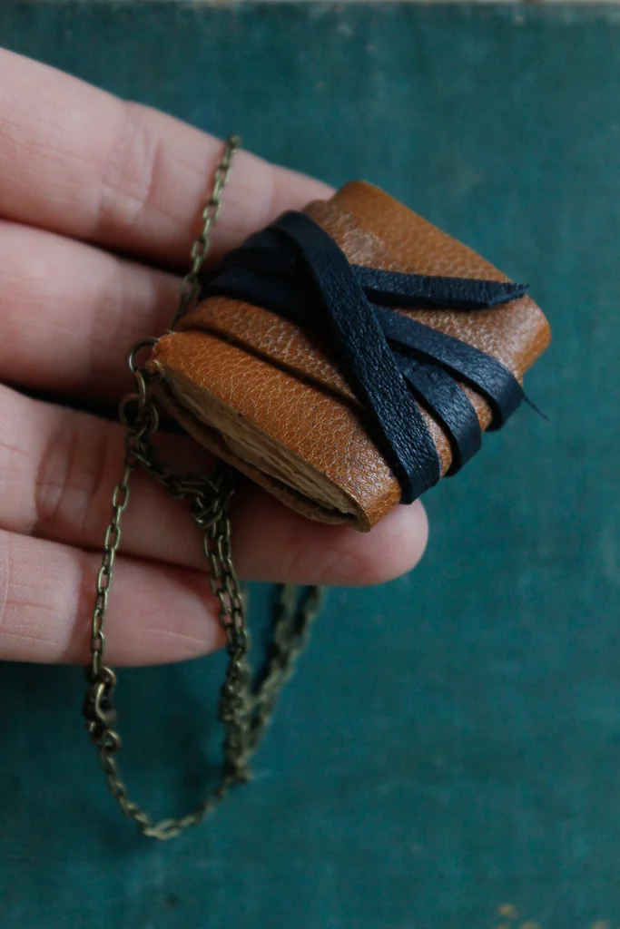 Tan leather book necklace