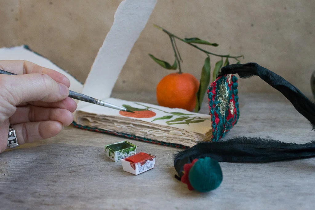 Miniature fabric art journals