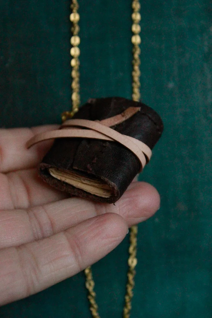 Cacao | Miniature leather book necklace with hemp drawing paper